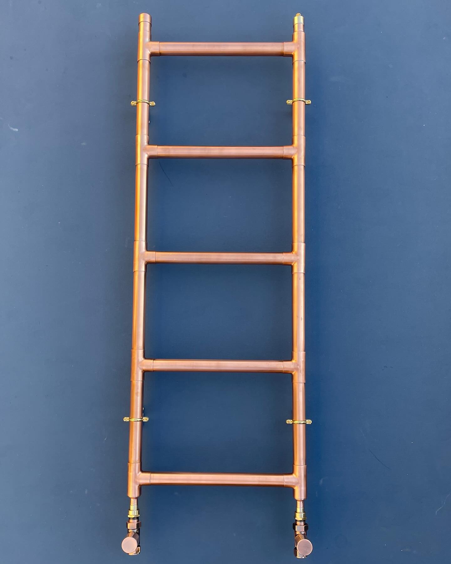 A little classic ladder style copper heated towel rail made this week, perfect for hanging and warming your towels. These heated towel rails can be made in any size to suit your needs. Please just get in touch or visit the website at www.bowstreetinteriors.com #copperradiator #copperbath #copperbathrooms #copperbathroom #bespokebathrooms #vintagebathroom #towelrail #towelradiator #radiator #copper #copperpipeart #copperpipework
