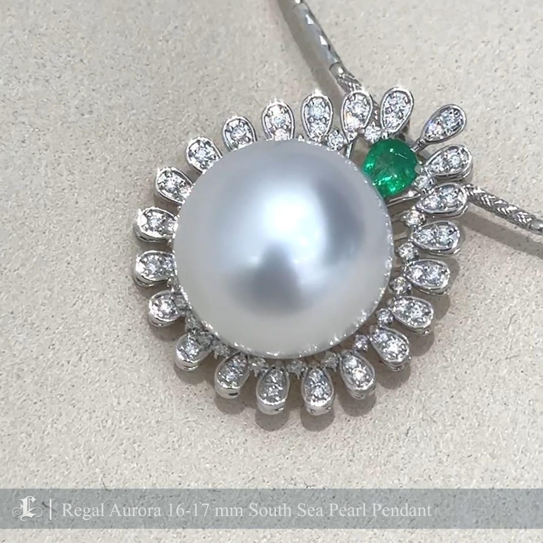 This majestic pendant features a 16-17mm perfectly round South Sea pearl, celebrated for its unique cool-toned aurora luster and unparalleled size. Encircled by an intricate halo of brilliant diamonds and accented with a vivid green gemstone, the design exudes regal elegance. The meticulous craftsmanship and sophisticated arrangement create a timeless piece that captures attention with its royal demeanor. Ideal for special occasions, this pendant is a statement of refined luxury and exquisite beauty.
#southseapearljewellery #southseapearlpendants