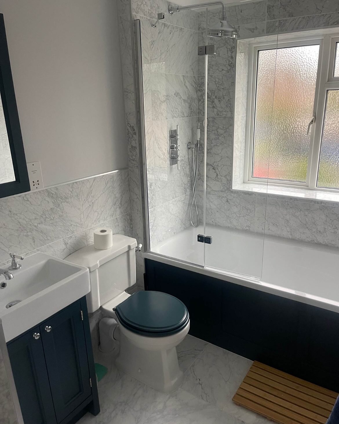 Old School Vibes meets Modern style ✨
Here is a lovely two room project recently completed in Cranleigh 📍
For this room we used Traditional furniture and ceramics with modern tiles to create the perfect blend of aesthetic and function 👀
The Roper Rhodes Hampton basin units with the Harrow pan and Widcombe Mirror is the perfect way to get a colour co-ordinated result and a unique feel in each room 🤩
For this project we used the following brands:
🇬🇧Roper Rhodes for their stylish Basin, WC and Mirror, all in Derwent Blue for the Bathroom and Pewter in the En-suite 💙🩶
🇬🇧Vado’s Booth & Co Axbridge range for all taps and showering components. The perfect mix of traditional style and modern practicality finished off in their high-shine chrome ✨
🇬🇧Kudo’s showering glass on both the tray and the bath for the easy to clean practicality and minimalist style ⭐️
🇩🇪Bette’s Ocean for the perfect bath, super strong and easy to maintain at a staggering 1800mm length! Hidden overflow filler for a sleek look without cramping the style of the traditional valves 💪🏻🤩
🇬🇧Burlington and their brilliant Trafalgar Towel rail / Radiator for a stunning feature ✅
@roperrhodes @vado_uk @kudosshowers @burlingtonbathroom
#bathroominspiration #bathroomdesign #bathroominspo #interiordesign #bathroomrenovation #bathroomdecor #bathroomvanity #bathroomtiles #bathrooms #bathroomsofinstagram #bathroomsofinsta #bathroomstyle #luxury #luxurybathrooms