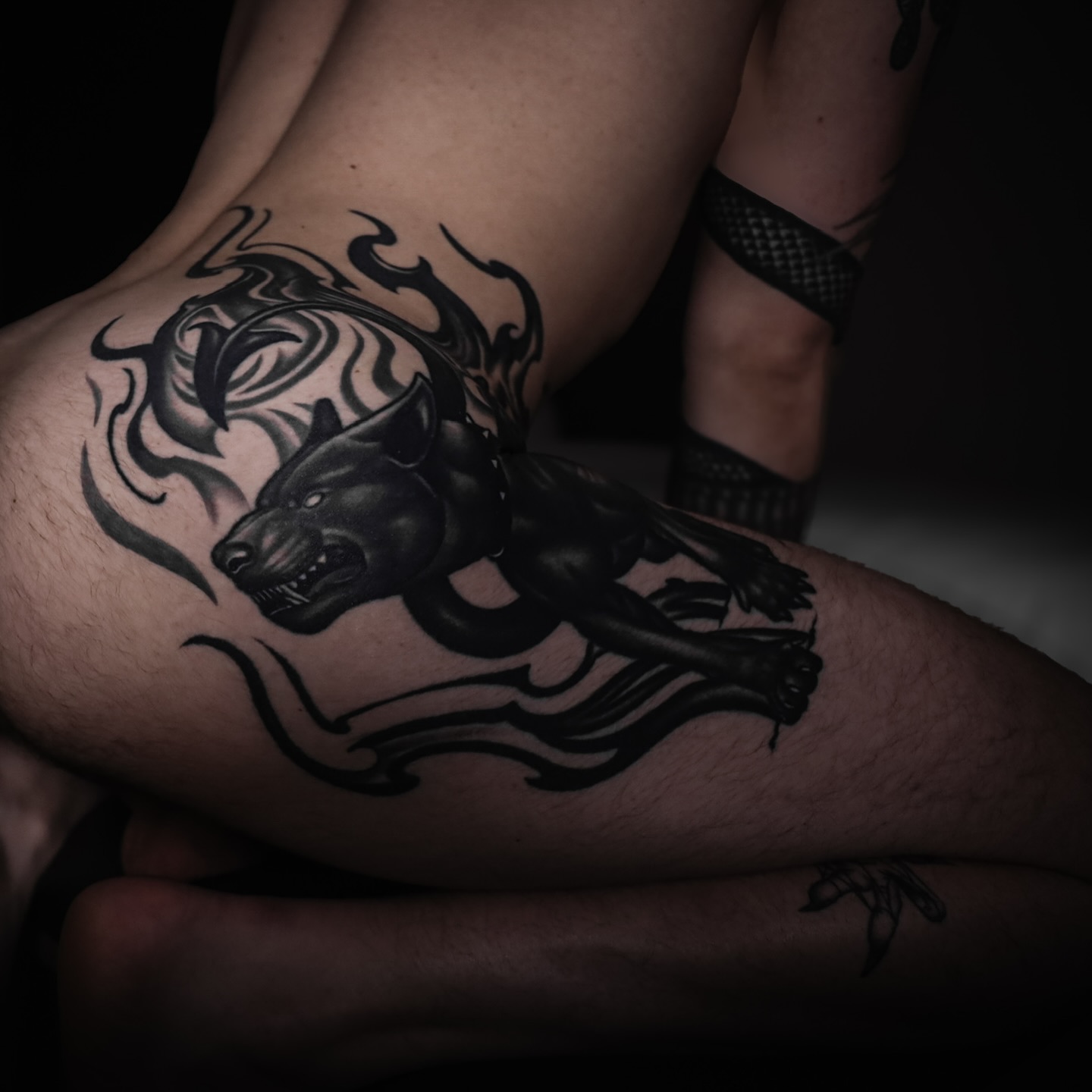 The intricate images etched across his skin tell a story of past struggles, triumphs, and hidden desires, each mark a visual reminder of the journey that shaped him.