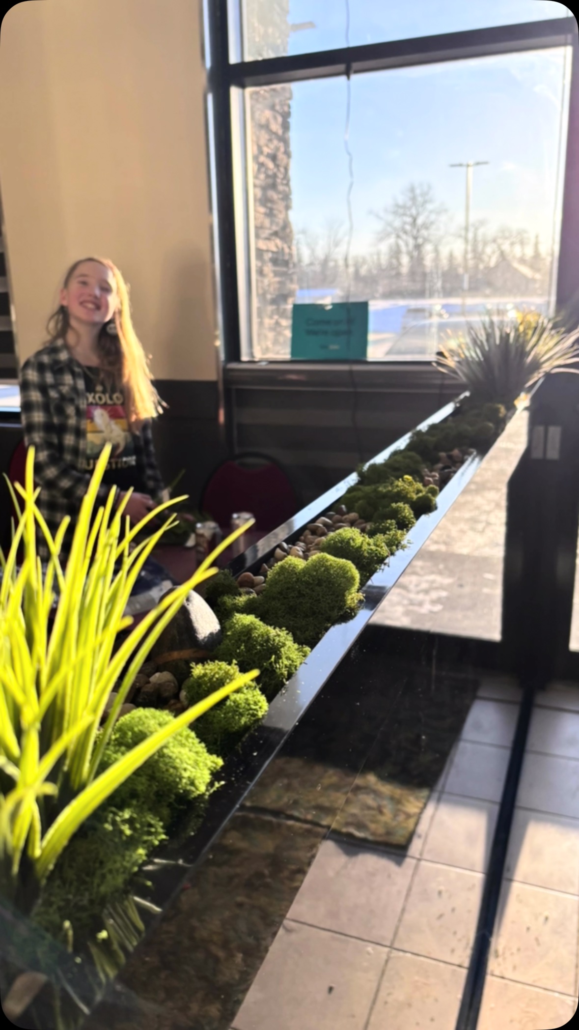 Miss O felt like this built-in feature at the restaurant could use an update from the small vine leaves and potted plants that were there.
We knew budget iwas a consideration, so she added river pebbles, natural moss, small fescue and lava rock to coordinate with the colour palette and brand of the establishment and current interior trends.
She even added a piece of her own quartz to amplify abundance for the owners of this new establishment!
A pretty successful day and creative expression for my side kick!
#interiorupdates #craft #diy #smallproject #greenery #restauranttogo #vegetarian #indian
