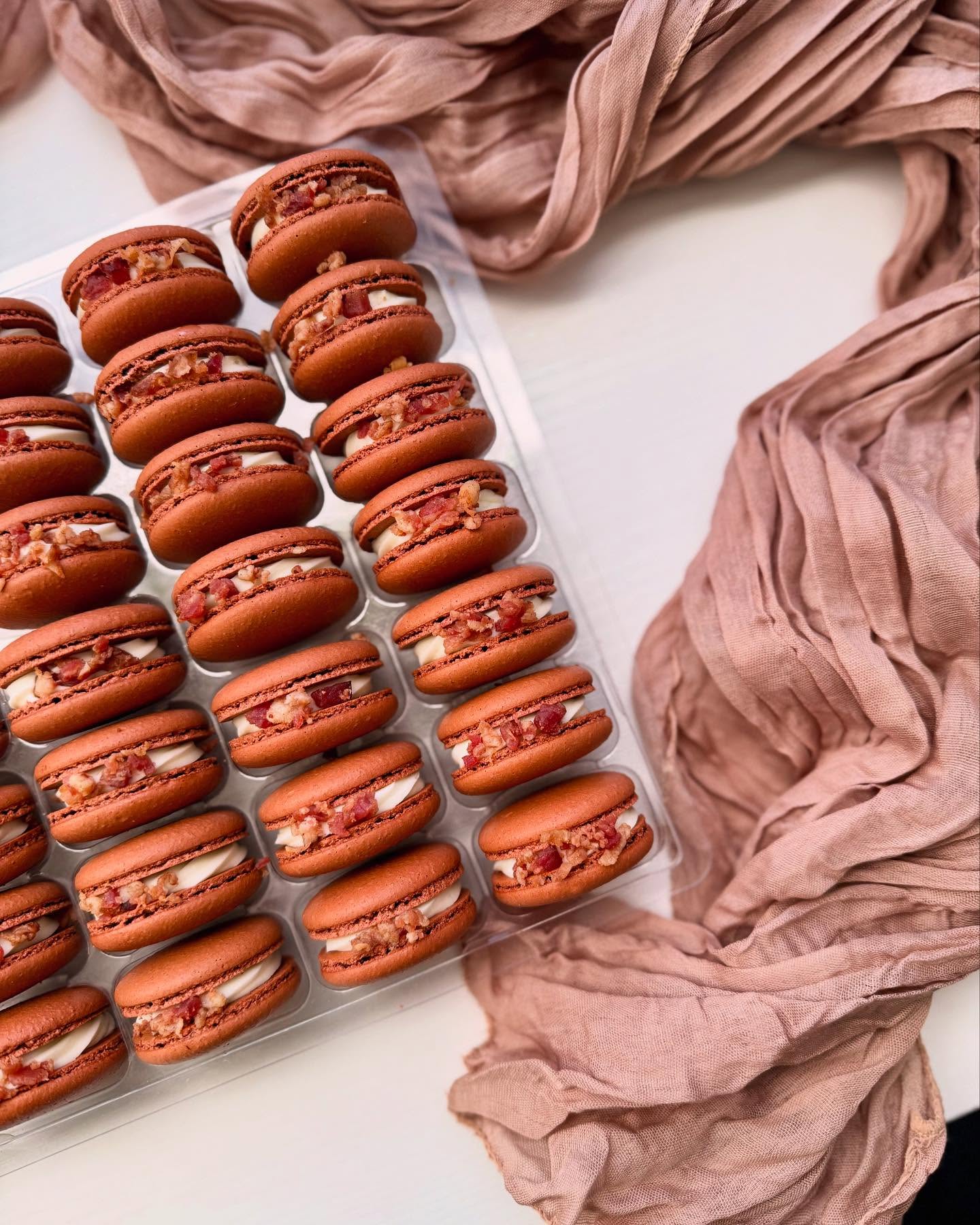 Maple Bacon Macarons | Bacon flavored ganache with a pure maple syrup center and garnished with bacon bits