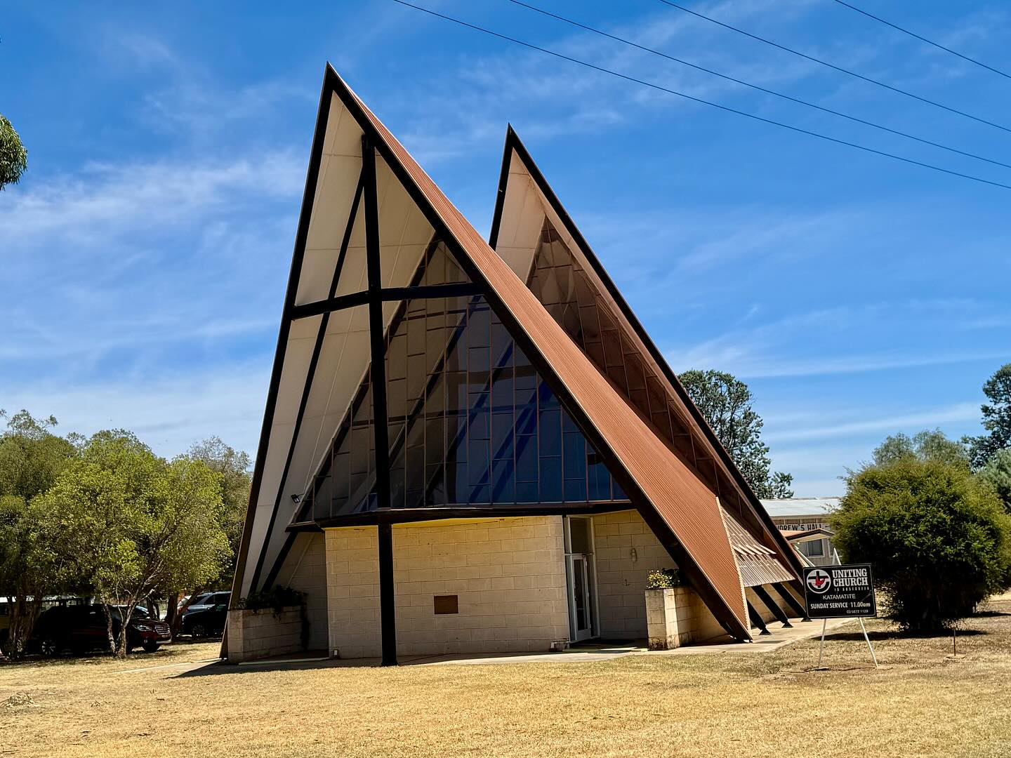 Katamatite Methodist (now Uniting) Church—(John) Muir and (Arthur) Shepherd, 1961. Erupting forth from the vast boundless flats of the Murry Valley... amongst the most expressive, futuristic examples of postwar modernist ecclesiastical (and roadside) designs in Australia. Unlisted but clearly respected by the community.