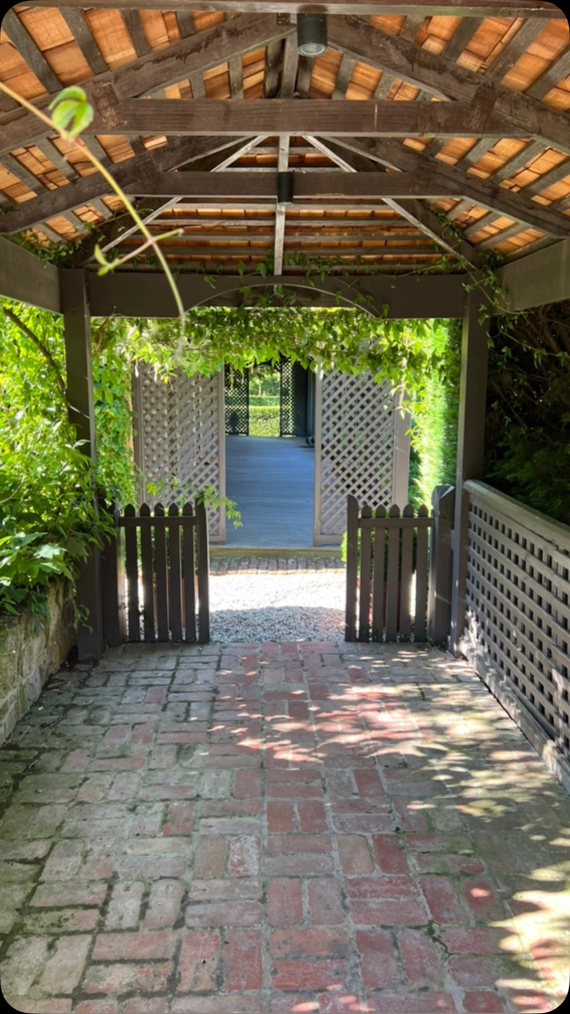 Sitting between the driveway and the Old Rectory is the Lych gate, which in 2023 had a new shingle roof installed: it’s the perfect spot to unload luggage, particularly if there’s rain about (we wish)!
Historically however Lych gates had another purpose. Built at the entrance to English churchyards from as early as the 14th century (there’s reference to such a structure at the funeral of Edward II in 1327), the space was designed to shelter the coffin on its way to the funeral service. In those days coffins could be carried long distances from outlying farms and hamlets and so a resting place, where pall bearers could recover from their exertions, and shelter from rain (and heat), was needed.
Our Lych gate, built a little more recently than 1327, has happier uses: luggage storage as already mentioned, but it’s also a charming spot to set a table for lunch or afternoon tea. In Spring the lych gate is covered in Rose rambling rector and Clematis (last image), adding to its charm and erasing any thoughts of death and coffins!
“Lych” comes from Anglo Saxon word “lich”, meaning corpse.
Most of the above information comes from @CountryLife magazine, “First out of the Lychgate”, 27 November, 2024.
@visitmacedonranges
@piperstkyneton
@daylesfordmacedonranges
@businesskyneton
@visitvictoriaaustralia
@airbnb
#kyneton
#kynetonaccommodation
#oldrectory
#oldrectorygarden
#lychgate
#ramblingrector