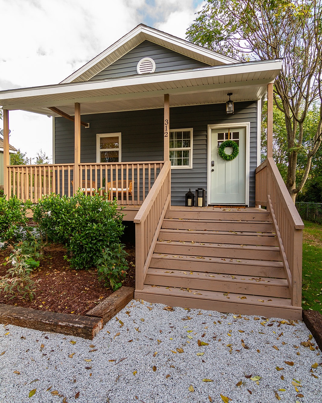 3 Design Tips from this successful AirBnB that you can use in your home.
1. Carry a principal color into each room of the house and outside to create a cohesive, purposeful look.
I love navy. Always have and always will. We carried this dusty navy color into each room and I think it helped this 900 square foot home feel like one big spacious room.
2. The paint, cabinets, and tile were all timeless colors.
For this project, we wanted to make sure each of these elements had personality but not obviously anchored in a specific design era.
This way, if the owner decided to update the aesthetic, they don’t have to majorly overhaul the expensive aspects of the home like tile or cabinetry. They only need to swap out furniture.
3. Hardwood floors
It is more expensive up front to install. However, not only is it a timeless look, real hardwoods can be sanded and stained a couple of times over its lifetime.
There is a time and a place for LVP. But don’t be pressured to install LVP just because it is “cheaper”. If you find mold under this waterproof material, it can be costly to remediate and the same product may not be in stock anymore.
What do you like about this little Airbnb in downtown Raleigh NC?
We love helping investors find, purchase, design, renovate, and stage investment properties in the Raleigh Durham area.
Paint on walls: Agreeable Gray @sherwinwilliams
Stain on floors by @minwaxusa
Bed @wayfair
Bedside table and artwork @homegoods
Rugs and cabinetry hardware @amazonhome
Tile @homedepot
Cabinetry @jkcabinetry