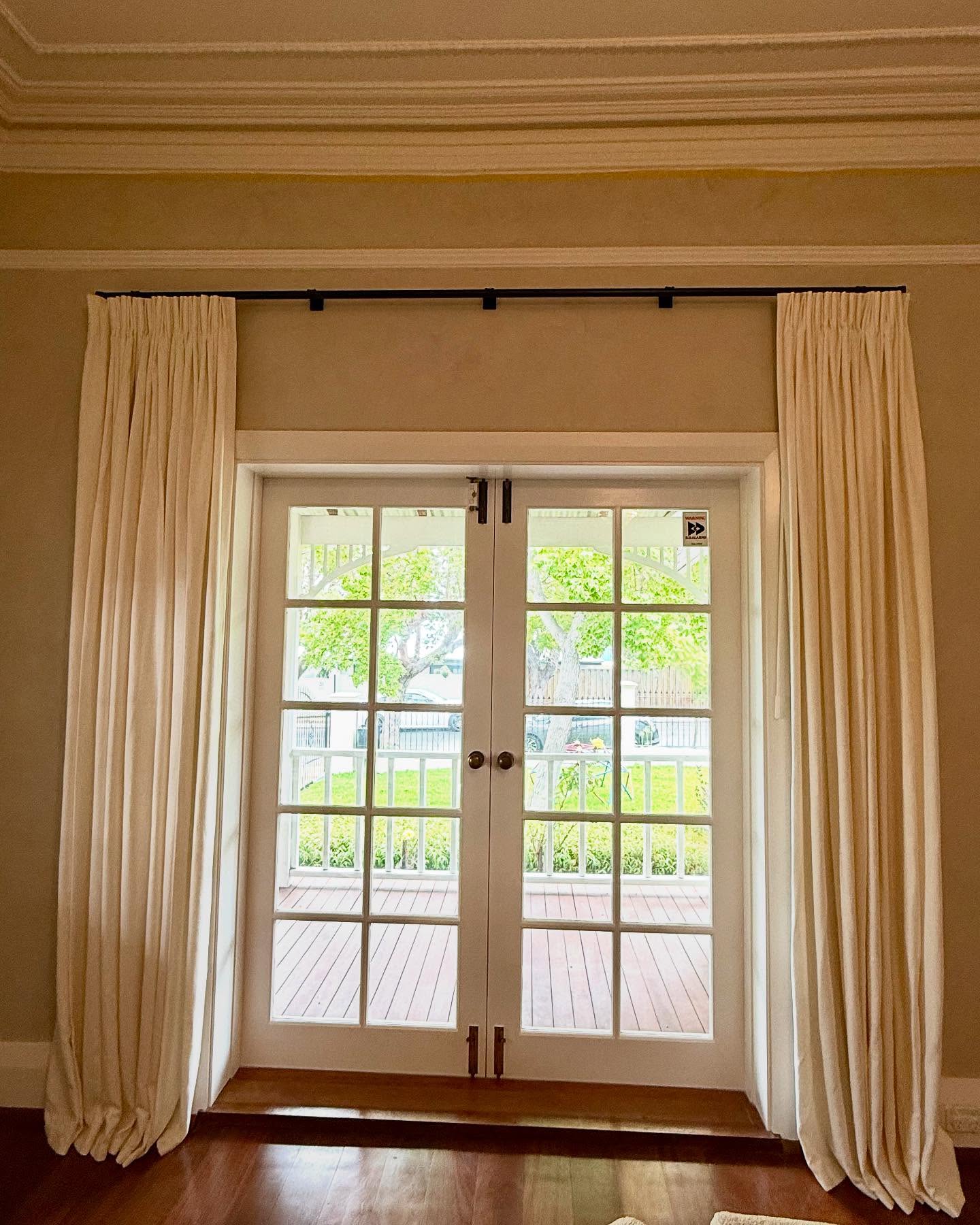 Gently puddled unlined linen curtain fitted onto an antique bronze rod produced for @whitestudioandco | #windowtreatments #curtains #windowstudio #linen #perthcurtains #perthinteriordesign #perthinteriordesigner #perthinteriors