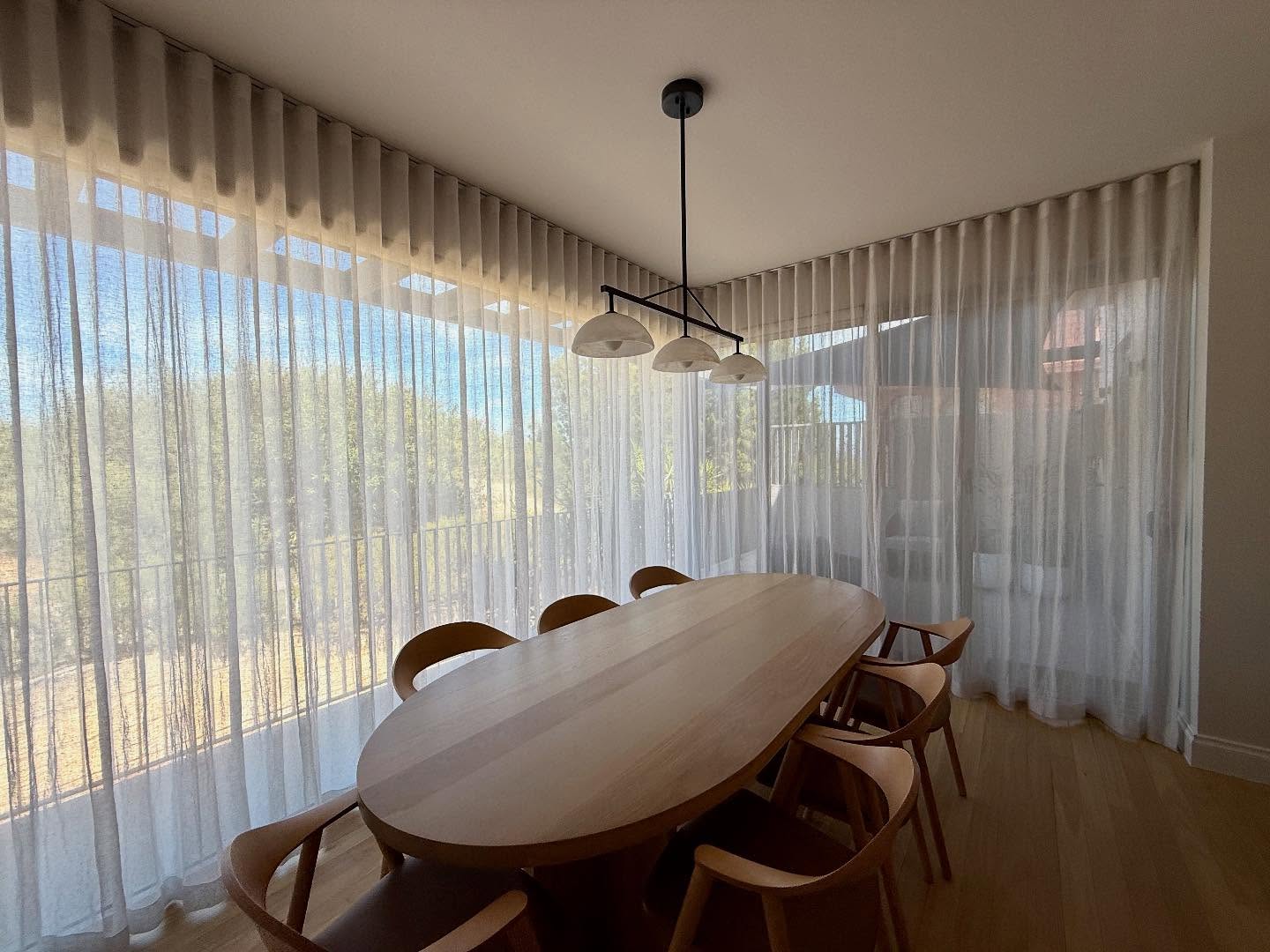 Sheer linen curtains with motorised blockout rollers behind produced for an interior project by @m_interiors | #curtains #windowtreatments #perthcurtains #perthblinds #linen #perthinteriordesign #perthinteriors #windowstudio