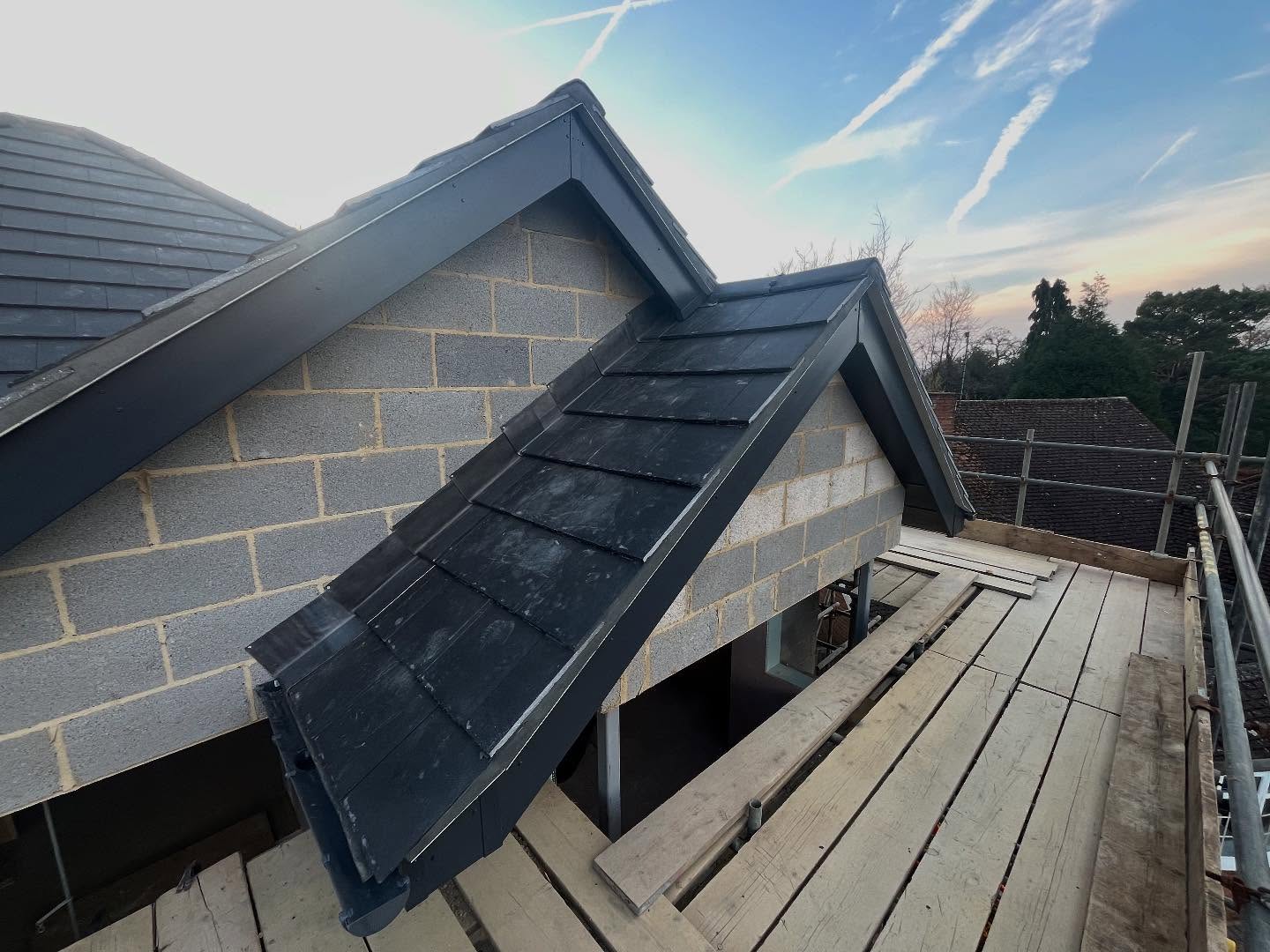Roof work now finished off in new house build looking smart with anthracite tiles and with black pointing. Solar panels installed neatly into tray so they sit flush with roof and two velux windows installed. Plastering progressing well inside upstairs nearly complete ready to move down stairs first fix plumbing installed with bath in position and niches ready all for wall tiling to begin. #alderson #building #roof #roofing #rooftile #veluxwindow #solarpanels #roofer #plaster #plastering #bath #bathroom #plmber #plumbing