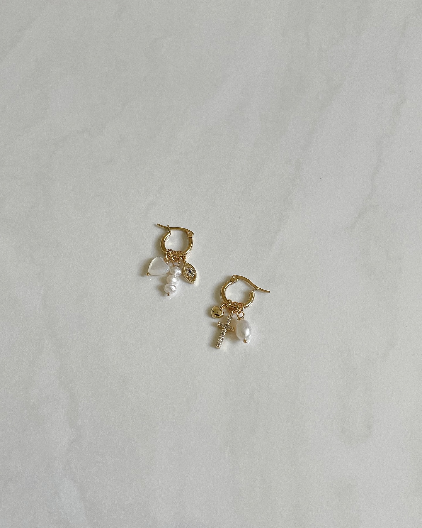 LOVER. 💘 18k gold plated stainless steel earrings with different charms that you can easily take on and off and wear in different ways.
https://www.jellek.si/product-page/lover