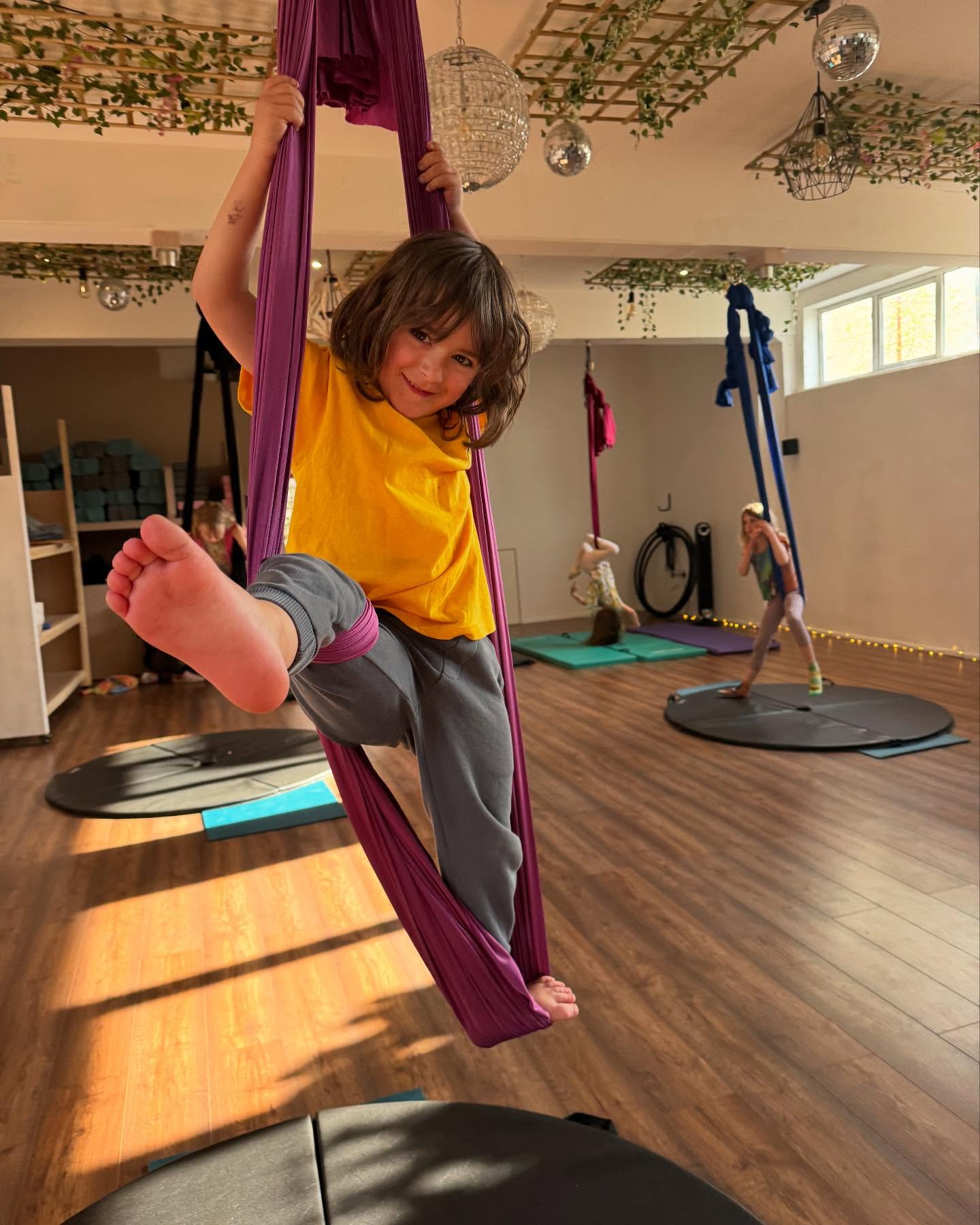 Gorgeous sun drenched shapes from kids Aerial Hammocks today!
Keep your eyes peeled for kids aerial routine building sessions over the next few months as we lead up to our July show! These classes will help the children put together a piece for the show, if they want to perform, but is open to any children that want to start to build longer combos to music!
I’m so excited to see what they come up with this time!