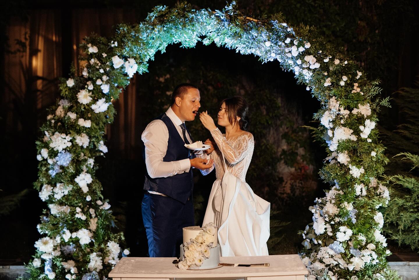 ✨Crafting unforgettable moments like this — where every detail, from the floral arch to the cake design, tells their love story. This is what wedding dreams are made of.✨