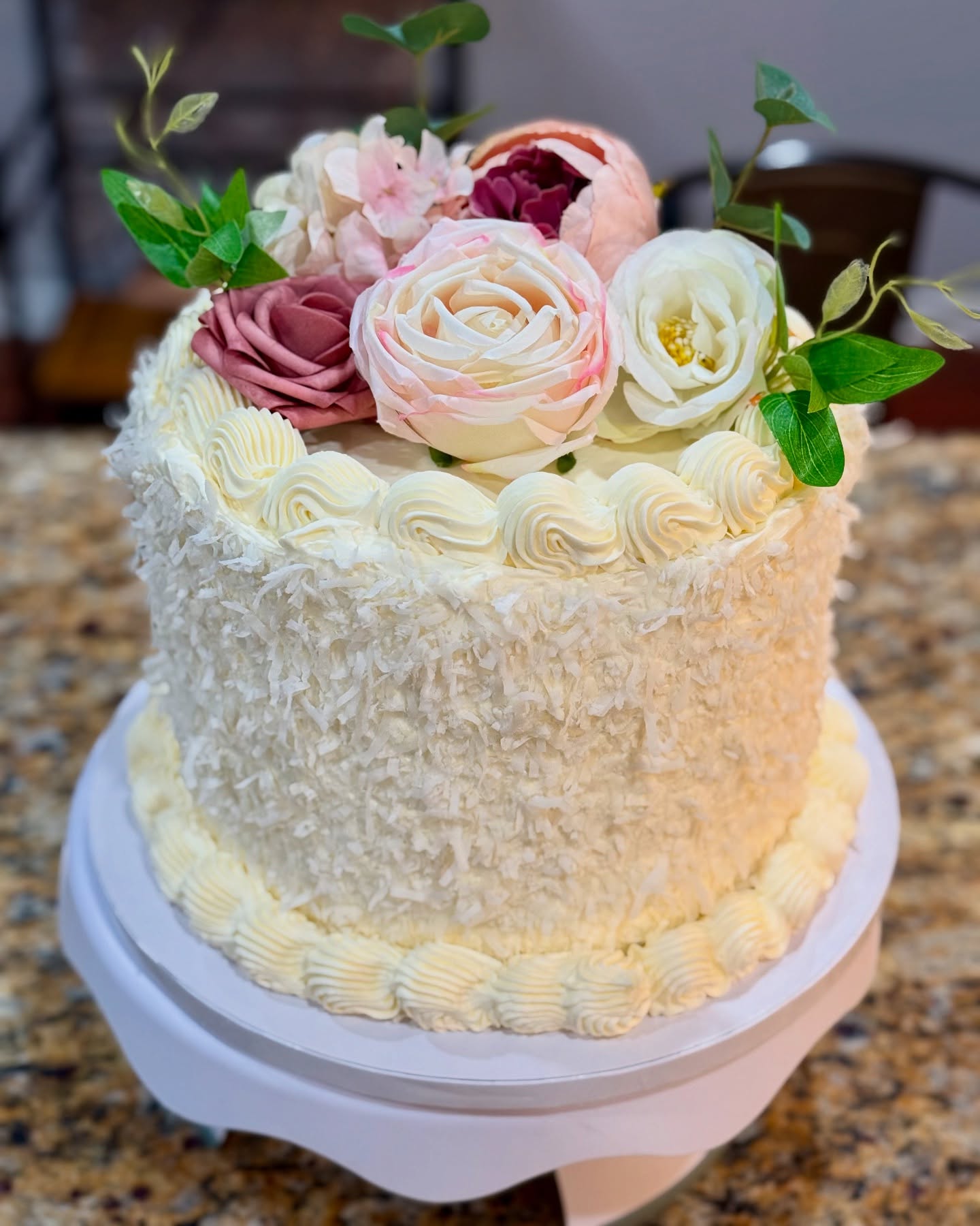 This cake was made to celebrate my mother in laws birthday—a little piece of her story, layered in cake.
Growing up, her mother would bake a devil’s food cake from scratch for every birthday, a tradition that stayed with her all these years. I wanted to bring a bit of that memory back, so I started with two layers of rich devil’s food cake.
The MIL, Joette, also has a love for coconut—she has been known for her famous impossible coconut pie—so I added a coconut cake layer, frosted everything with coconut buttercream, and finished it off with shaved coconut and a few blooms, simple and beautiful, just like the gardens she loves.
An ode to nostalgia and to some of Joette’s favorite flavors.
A meaningful cake for a meaningful birthday.
.
.
.
.
.
#70YearsLoved
#BakedWithLove
#CoconutCakeDreams
#DevilsFoodCake
#BakingWithHeart
#CelebrationCake
#BakersOfInstagram
#CakesOfInstagram
#BakingMemories
#ButtercreamDetails
#BakedEdges
#HomemadeGoodness
#MadeWithLove
#LayerCakeLove
#SmallBatchBaking
#CakeArt
#MilestoneMoments
#FamilyTraditionCake
#yourlocalbaker
#yoursharpsburgbaker
