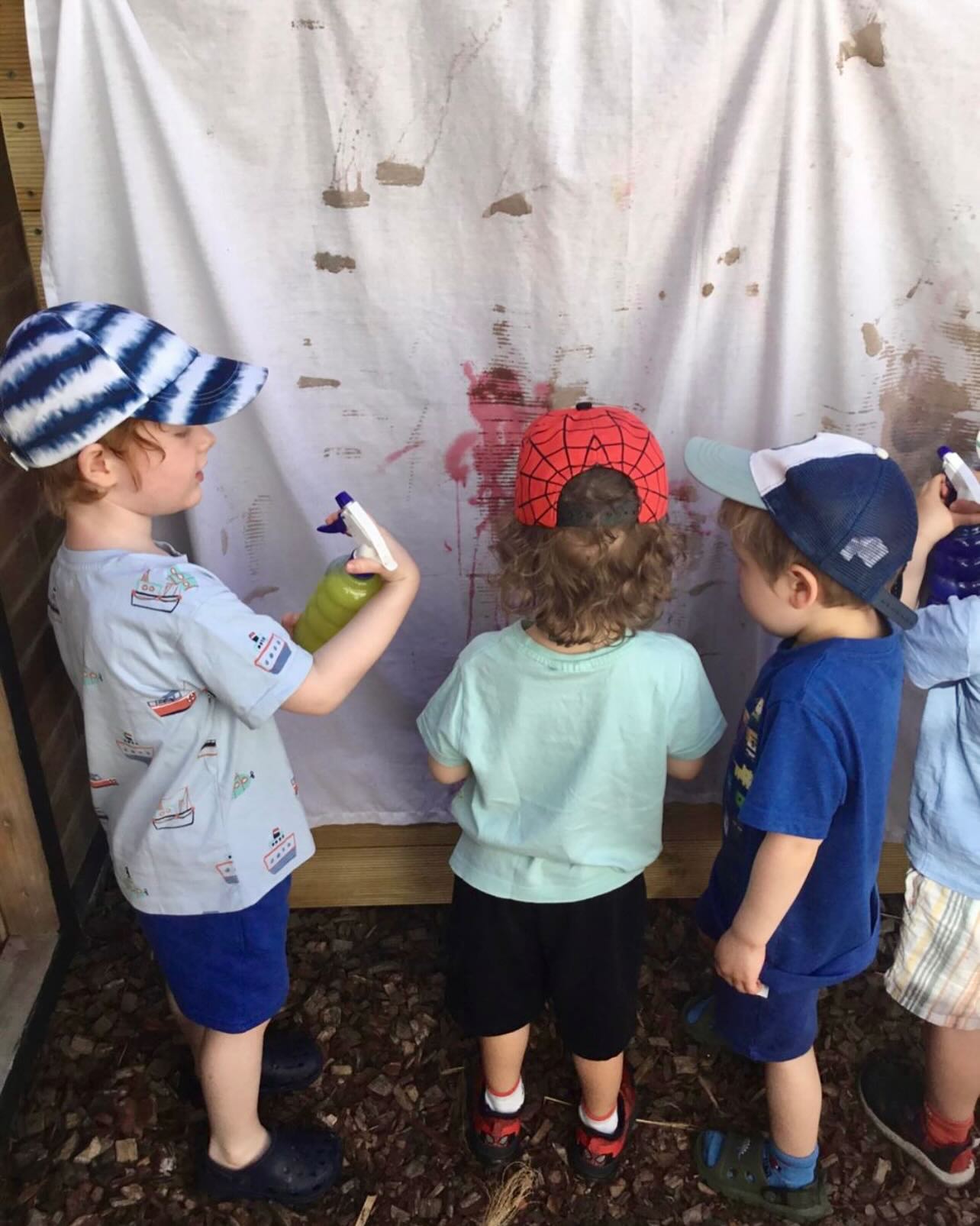 Experimenting with different types of materials on our new large scale art area. Today the children used paint diluted with water in spray bottles. It’s a great opportunity for the children to start conversations about art, ideas, and feelings as well as the physical act of strengthening our hand and finger muscles! #westbridgford #independent #nursery  #est1988 #underfundedchildcare #ndna #earlyyearseducation  #holidayclub #outofschoolclub #openendedplay #earlyyears #play #curiosity #letthemplay #outdoors  #learningthroughplay #milliesmark #birthtofivematters #earlyyearsoutdoors #milliesmark  #2025 #april  #keepingchildrensafe #thewhitehousedaynursery
#aweandwonder #spring