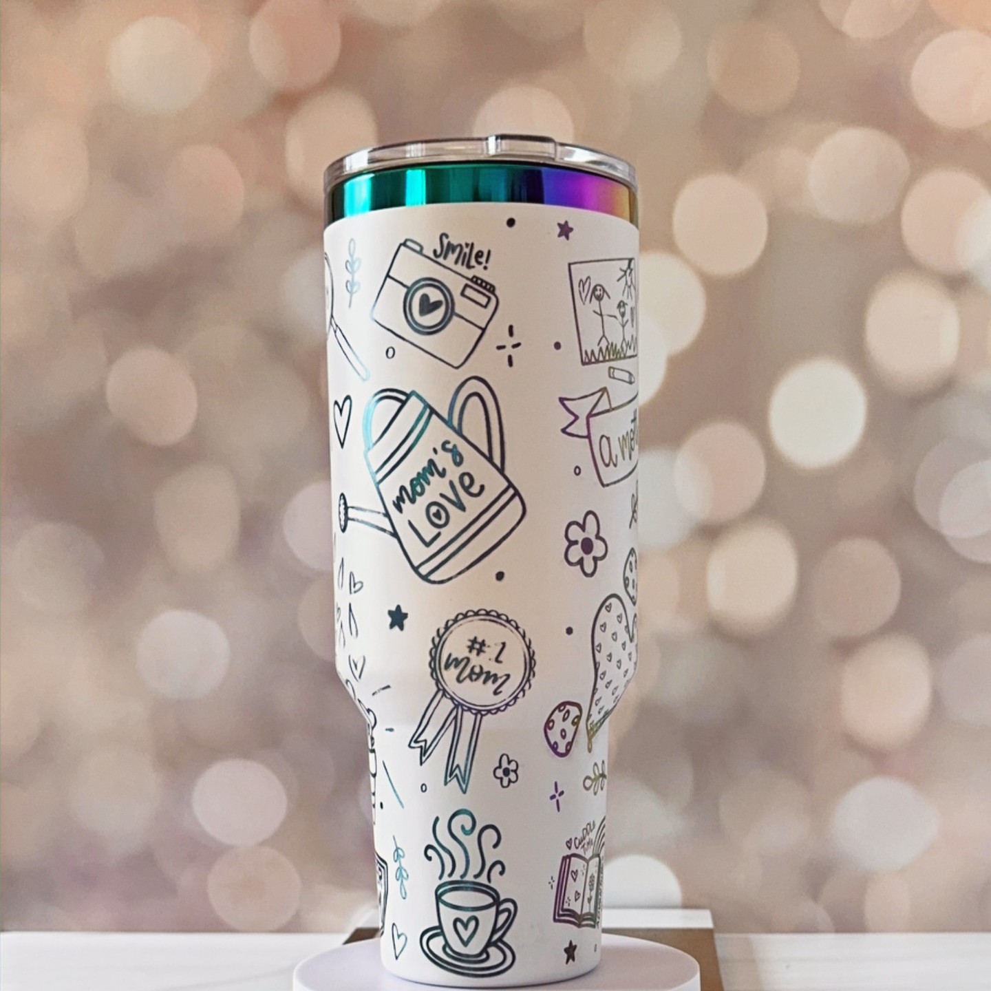 Sip in style with our enchanting "Mom Life" 40oz tumbler! 🌈✨ Perfect for busy moms, this dazzling tumbler combines beauty & function. Link in Bio #MomLife #Tumbler #EverydayMagic