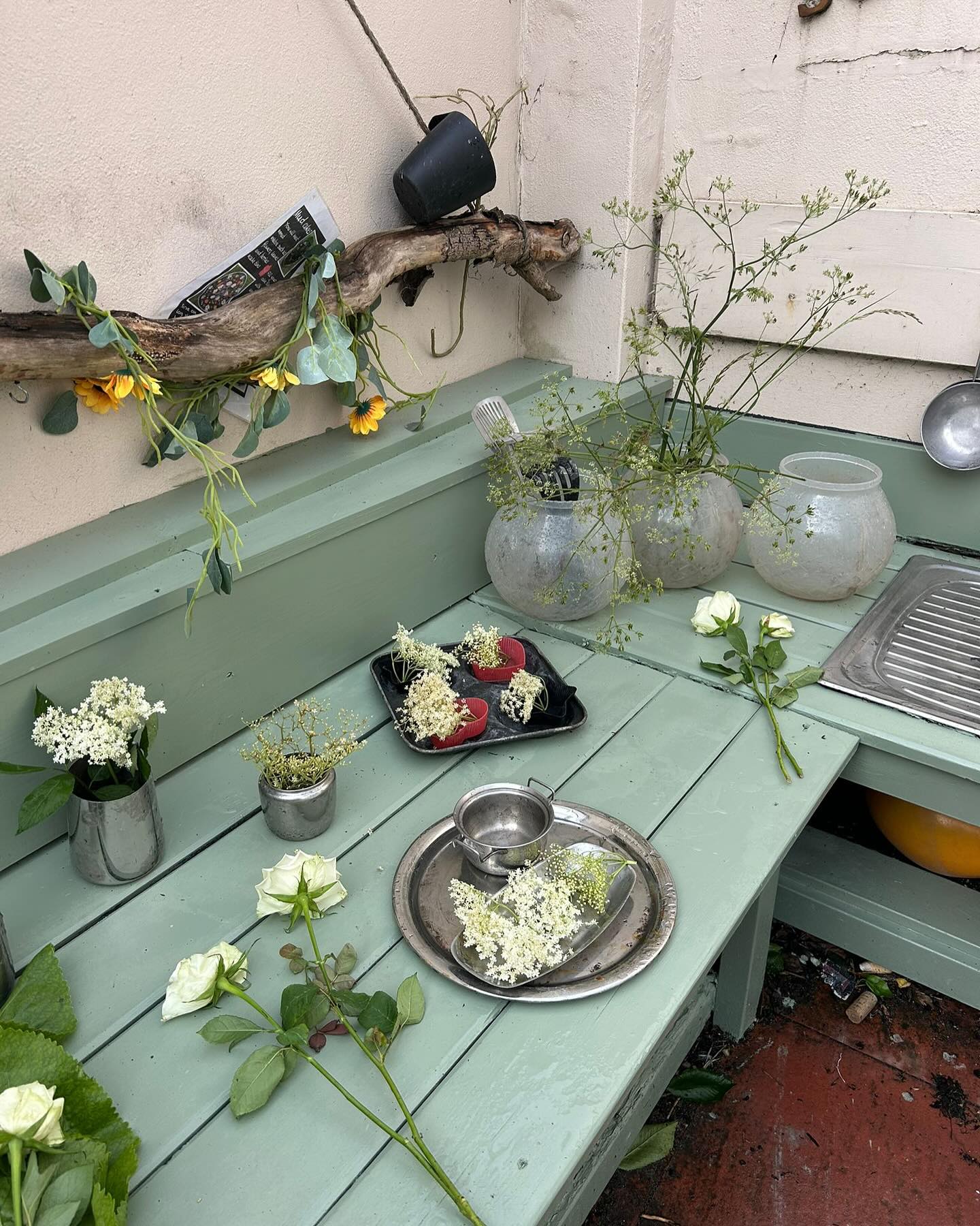 Thank you to Tim our handyman for repairing our much loved outdoor kitchen, Ian for painting it this fabulous green over the weekend and for Karen creating a beautiful enhancement this morning. Great Team work 😍 creates great things 😍#westbridgford #independent #nursery  #est1988 #underfundedchildcare #earlyyearseducation  #openendedplay #early years #play #curiosity #letthemplay #outdoors  #ndna#learningthroughplay #milliesmark #birthtofivematters #earlyyearsoutdoors #milliesmark  #2025 #may  #keepingchildrensafe #thewhitehousedaynursery
#aweandwonder #spring #outdoorkitchen #teamwork