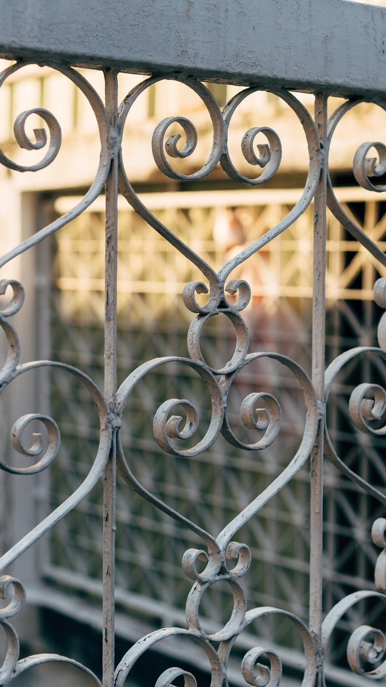 What is it about a wrought iron gate that sets a tone of anticipation? Maybe it is the elegance found in the decorative finials or the sturdiness of the pickets, the low creak as you push open the door and peer beyond.
Wrought iron gates have marked thresholds for centuries, first as fortified entries in medieval castles and churches, then as ornate features in the English garden.
Ironworking began around 1200 BC during the... yes, you guessed it: Iron Age! Wrought iron, a tough, malleable form of iron with low carbon content, was originally produced by heating iron ore in a bloomery or furnace. By the Roman era, wrought iron was used for tools, weapons, and structural elements.
By the 17th and 18th centuries, England had become a global leader in ironwork, thanks to abundant natural resources and innovations like the blast furnace and puddling process (the ability to mass produce wrought iron from pig iron). In garden design, wrought iron gates symbolized order, transition, and taste, crafted not only for security, but to frame views, invite curiosity, and express harmony with nature.
Designs by master artisans like Jean Tijou, whose work graces Hampton Court, reflected wealth and cultural refinement. Though mass-produced cast iron later dominated, the Arts & Crafts revival brought back the artistry of hand-wrought gates.
Today’s LH Discovery:💡
Many wrought iron finials, the decorative tips on gate pickets, were inspired by nature and heraldry. Common motifs included:
Spearheads = defense, vigilance
Fleur-de-lis = purity, French royal influence
Pineapples = hospitality
Acorns = growth and endurance
Urns or flames = remembrance and eternal life