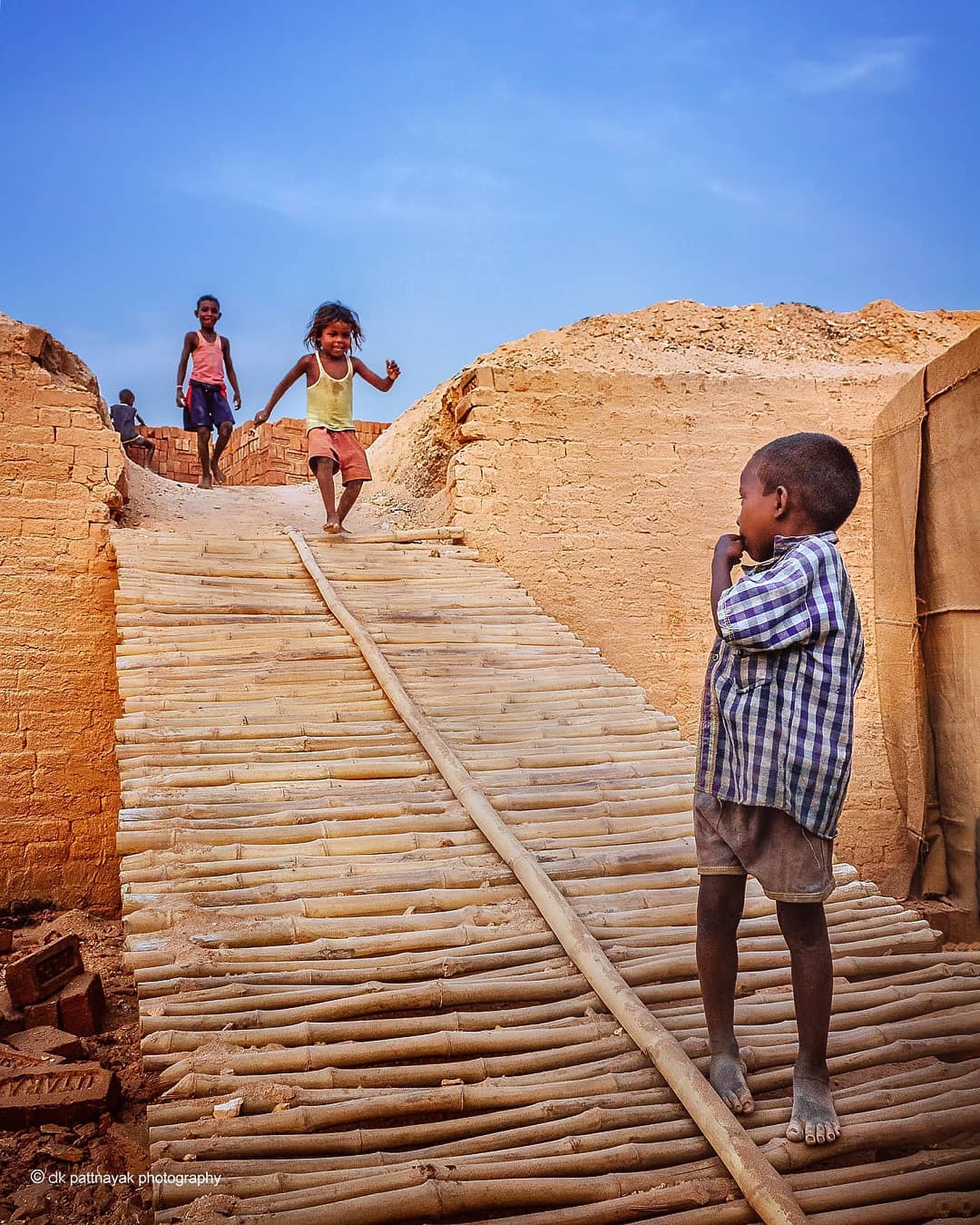 At the brick kilns of Odisha, shot by (@dkpattnayak), childhood runs on a different clock. While their parents toiled under the sun, these kids found laughter and games in the very dust that built their world.
Here, often school bags are swapped for sacks of clay, play breaks for work shifts. For many kids here, growing up begins too soon.
And with each passing year, the heat rises. Climate change isnāt some far-off worry-itās already shaping how long they can work, how often they fall sick, how harsh their world becomes.
However, childhood is free of these worries. The worldās a playground, and joy doesnāt need any settings.
#theimpactsociety #culture #childhood #tradition #labourinindia #brickkilns #brickfactory #peopleofindia #brickfactoryofindia #photographer #storyteller #documentary #visualstorytelling
