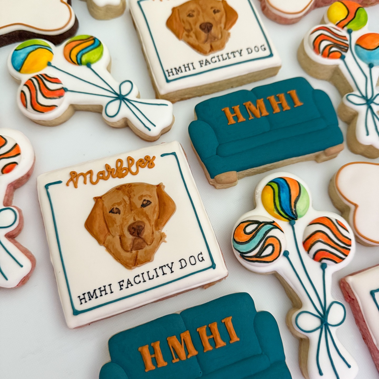 These cookies are for Marbles, the newest team member at Huntsman Mental Health Institute!
Marbles has been trained since early puppyhood to work alongside clinicians to help kids who are worried or scared. She’s great at helping kids feel safe, building trust, and offering quiet support. Sometimes, just being near her is enough to make someone smile.
Having a facility dog is a project my daughter Elizabeth and her colleagues began over a year ago – getting the right stakeholders involved, navigating red tape, and completing the application process. Before long, Marbles (from @patriotpawsservicedogs) was winging her way from Texas to her new home in Salt Lake City!
When she’s not working, Marbles splits her time between Joanna (Elizabeth’s colleague) and Elizabeth’s household, where she’s settling in with her human family and her fur brothers, Joshua and Rudy.
#somecookiesbecause_byduveen #decoratedsugarcookies #decoratedsugarcookiesofinstagram #lincolnnebraska #lincolnccokies #nebraskacookiers #geschenkeausderküche #backenmitliebe #dogcookies #couchcookies #marblescookies #facilitydogsofinstagram