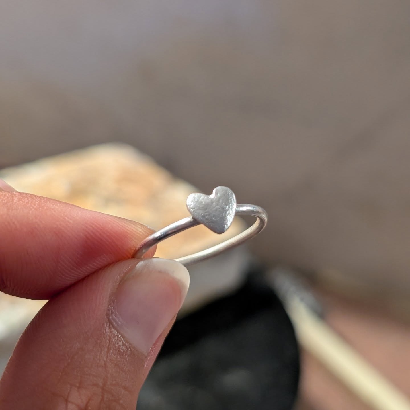 The sweetest little curved heart ring fresh off the bench today, just needs its final polish and I'm looking forward to making more of this one in various ready-to-go sizes.
➡️ Scroll across to see some other pieces I've been working on today when I could squeeze in some time around the children. Some more heart rings but these ones are on a slightly thicker band and flatter heart, some chunkier rings statement rings in progress and pretty rose leaf jewellery too. 🌹
I'm making stock where I can so I can be ready for the upcoming markets, as soon enough it will be in full swing again as we enter Autumn late next month! The making part is easily the best part of this fun adventure, being creative and seeing the processes coming together! 🤩
#workbench #silversmithing #silverjewellery #silver #handmadejewellery #workinprogress
#jewellerydesign #rings