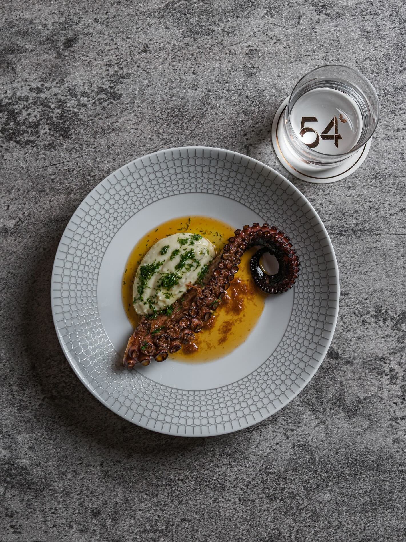 Grilled Octopus | Chorizo XO | Potato Mousseline
Tender and succulent octopus tentacle fresh off the grill boasting a nice char and crisp on the edges for that perfect smoky flavour and texture.
The gentle sweetness of the octopus is beautifully balanced by our rich and savoury house-made Chorizo XO sauce, featuring a mix of more than 10 ingredients. Comes with a classic potato mousseline.
Stay tuned, we are opening this August.
54° Steakhouse
54 Amoy Street, Singapore 069880