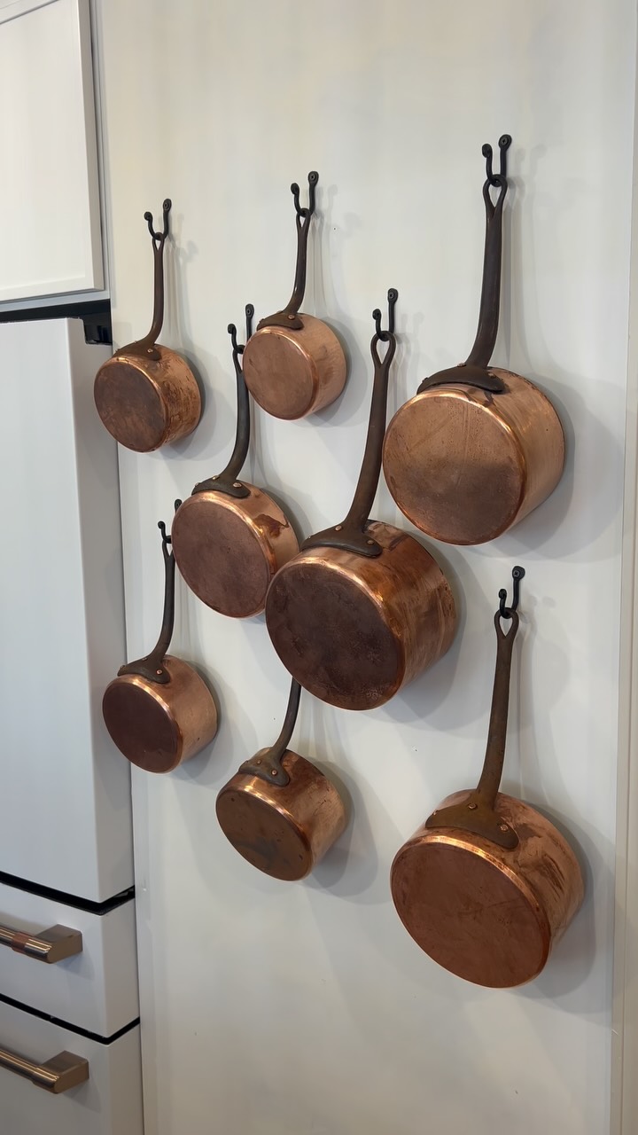 Installing a stunning functional decor wall in our client’s kitchen by displaying these magnificent authentic, antique copper pots that were imported from France! We had them professionally restored so that our chef of a client can use them to cook with as well as enjoy their beauty. #beautifulandfunctionaldesign #devengercottage