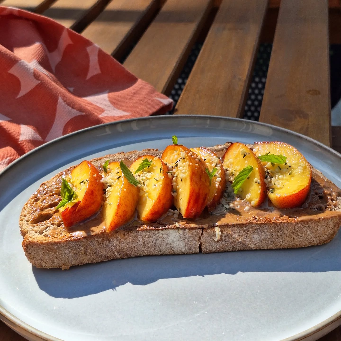 Easy breakfast that utilizes fresh Ontario peaches:
1. Make toast.
2. Spread said toast with almond butter.
3. Top with peaches, a drizzle of local honey, hemp hearts, and fresh mint.
4. Savour outside under a parasol!
#ontariopeaches