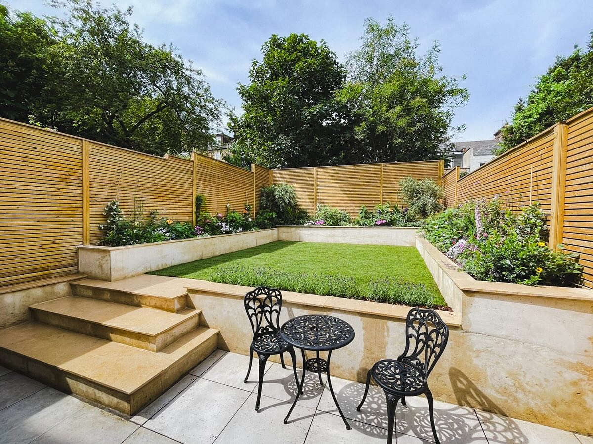 Complete garden transformation with a modern Mediterranean feeling !! Raised white concrete planters filled with perennial plants and beautiful olive trees. The planting was an updated take on Mediterranean with English cottage, clearly it has worked !! Full of colour using hundreds of plants the bees, ladybirds and butterflies will fill this garden. Limestone was used for the coping stones and steps. With batten fencing surrounding the garden. No side access however this didn’t stop the team from completely transforming this garden ! #mediterraneanplants #jasmin #salvias #alliums #agapanthus #lavenders #concreteplanters #limestone #battenfencing #newlawn #bees #butterflies #englishcottage #landscaping