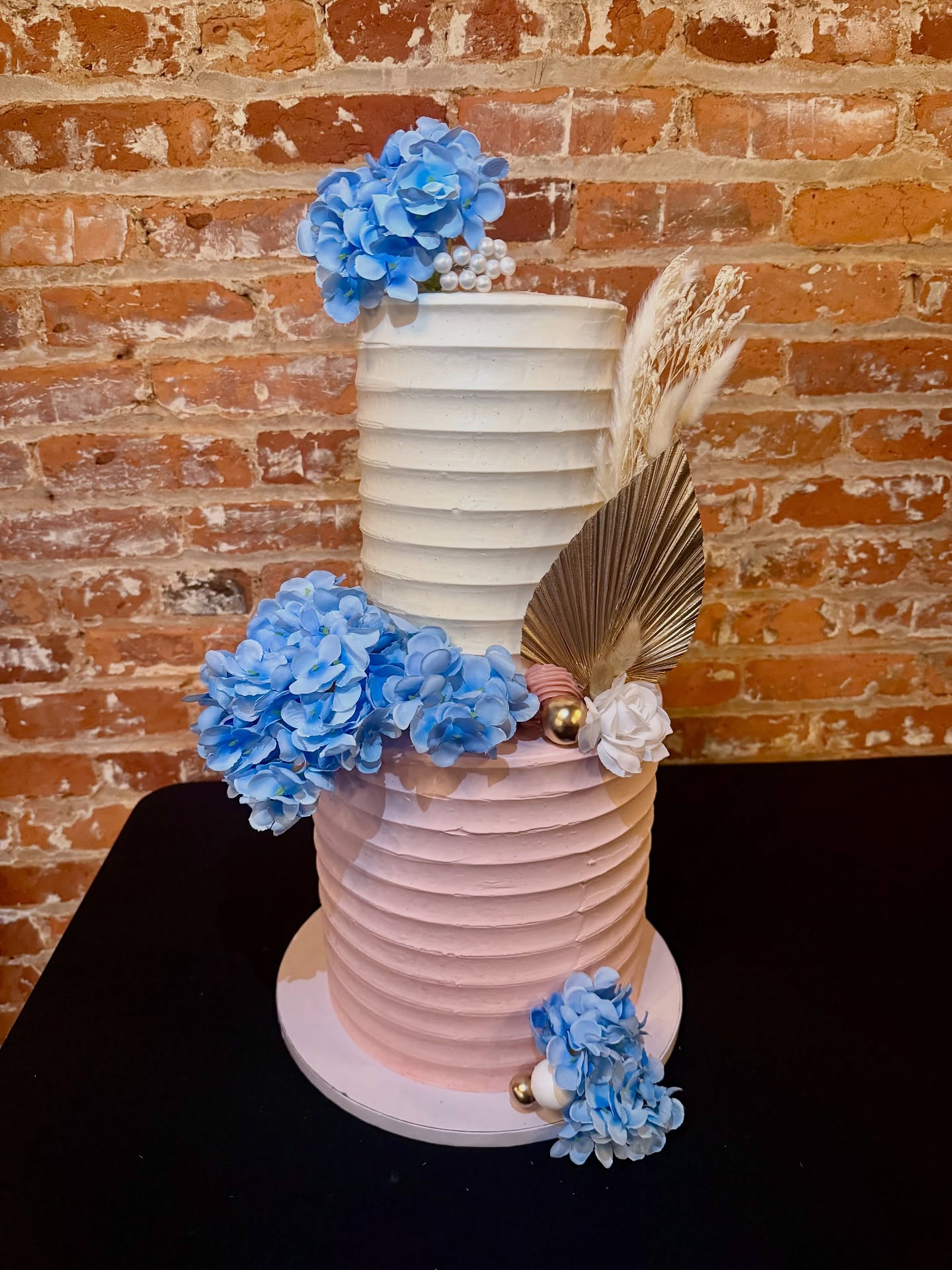 Congratulations to Dana & Wade!
Creating this romantic, boho-chic inspired cake with delicate textures and soft blooms was a joy!
Inside, layers of vanilla, chocolate, and marbled cake came together—representing two becoming one in the sweetest way. 💕