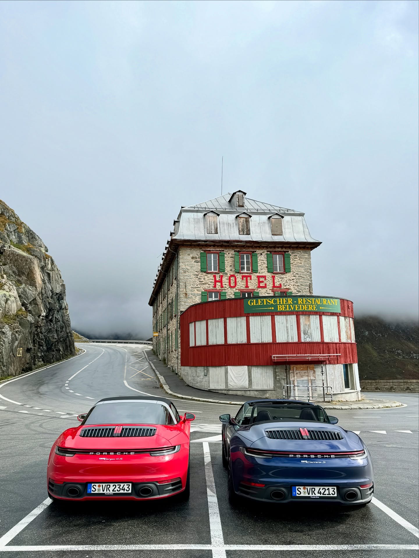 On the edge of the Furka Pass, two Porsches stand still before the legendary Hotel Belvédère — where timeless engineering meets timeless landscapes. This is not just a road trip, it’s Exclusive Experiences. #ExcExp #PorscheDrive #RoadTrip #FurkaPass