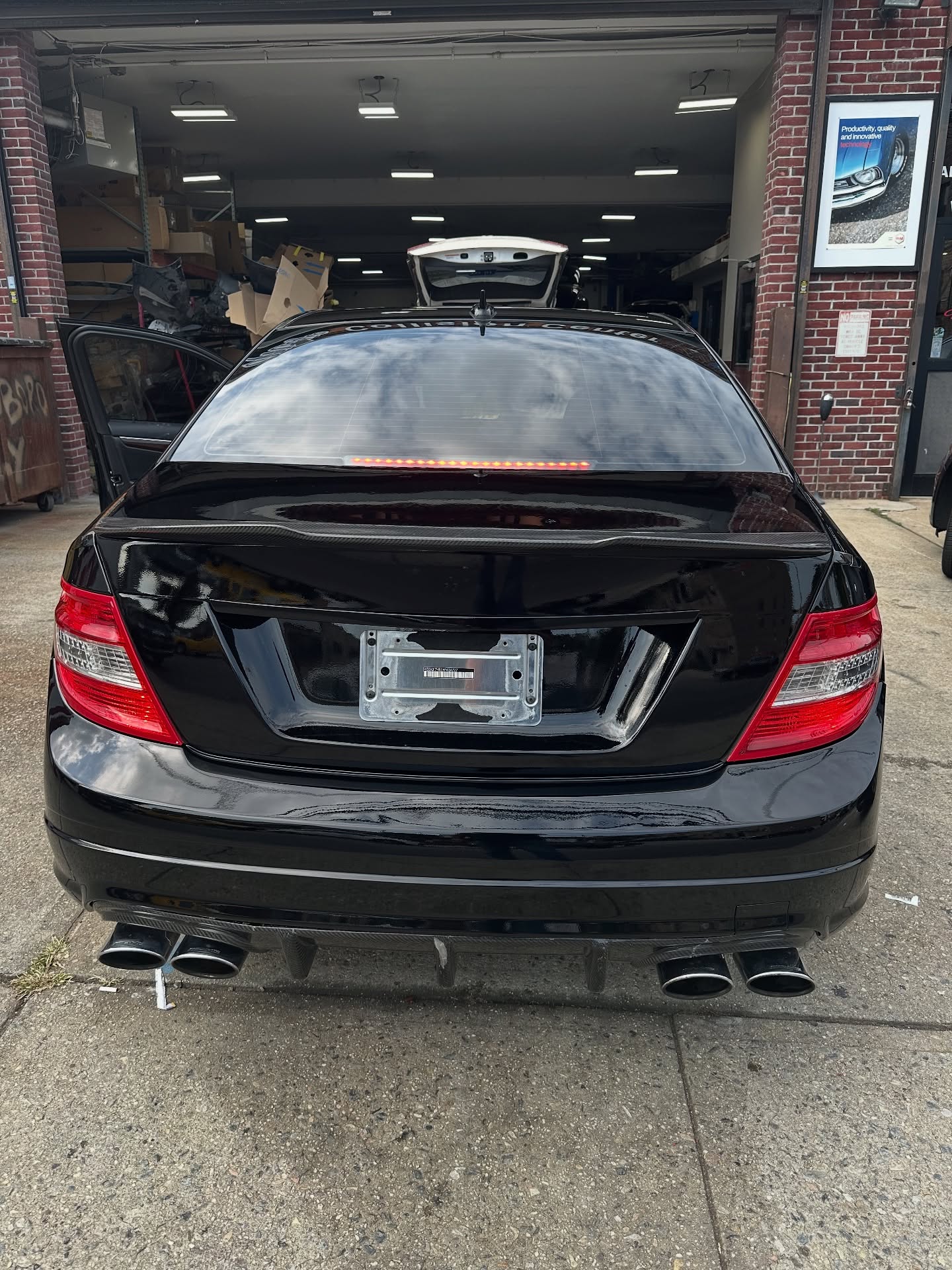 Carbon fiber trunk lid painted to match with carbon fiber spoiler added to this already awesome C63. #magiccollisioncenter #whitestoneny #queens #yourneighborhoodbodyshop #freepickupanddelivery #weworkwithallinsurancecompanies #doneright #basf #mercedes #cclass