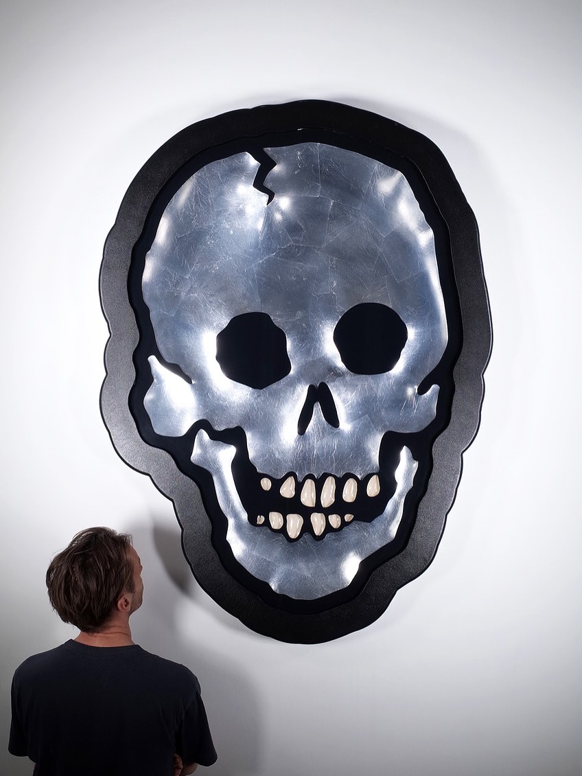 MEGA SKULL by Ryan Callanan
–
Part of the artist’s ongoing Mega Series, this oversized work showcases the studio’s ability to operate on a grand scale. It brings together Ryan Callanan’s exceptional craftsmanship and his expertise in handling specialist materials.
Created from a carved board base and finished with fine tin leaf, the piece is set within a hand-shaped frame. MEGA SKULL reflects the highly skilled approach that defines Callanan’s practice.
#skull #carved #art #poptorian #signage #ryancallanan #ryca