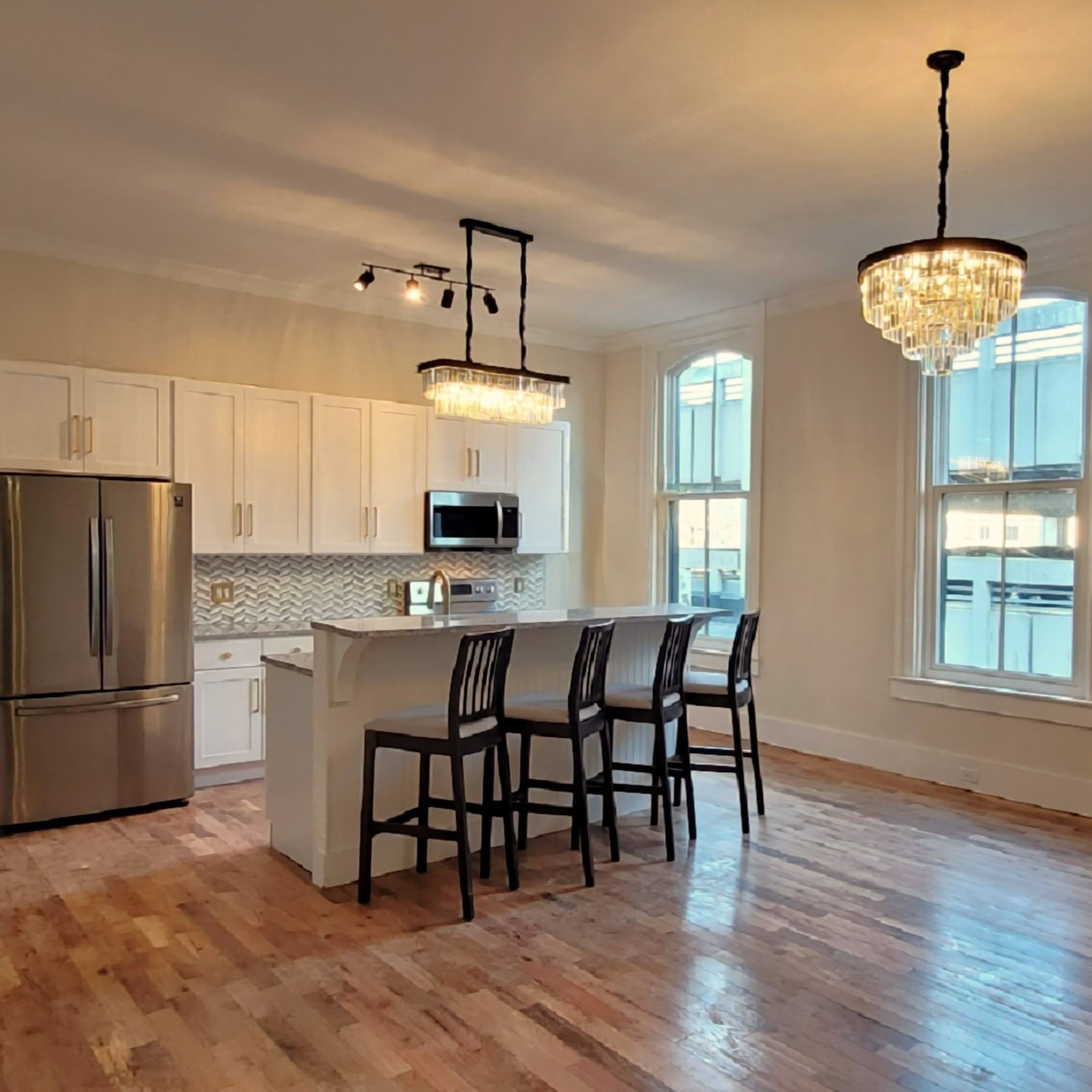 Available November! Apartment 202 is a 2-bedroom, 2-bathroom, that sits on the second floor of our brand new renovation in the heart of Downtown Elmira, featuring over 1000 square feet of beautiful space and a dramatic picture window- ready to be moved in November 1st!
Enter directly from the second floor of the parking garage, and into the building's grand foyer. The apartment consists of a spacious open living room and kitchen with an adjacent full bathroom containing a laundry closet. The two bedrooms each contain a spacious closet, and the master bedroom features a spectacular picture window, as well as its own private full bathroom.
The brand-new designer kitchen boasts tall white cabinetry, granite counter tops, stainless steel appliances including French-door refrigerator, glass top electric range, over-the-counter microwave, dishwasher, as well as a spacious island. The bathrooms feature oversized soaking tubs, tile floors and walls, custom vanities with granite counters, Kohler toilets, and brushed satin nickel bathroom fixtures.
Other features of this unit include brand-new washer & dryer, red oak wide-plank flooring, crown molding, individual energy efficient heating & air conditioning systems, and nearly 12 foot high ceilings! Beautiful new windows were custom built to replicate the building's original windows, and feature insulated glass for energy efficiency. Custom window treatments on the interior allow for easy control of the flow of light into the room.
Rent is $1795 + electric & garage parking; with water, sewer, and trash collection included in the rent!
#apartment #apartmentforrent #capriottiproperties #downtownelmira #elmiradowntown #elmirany #historicarchitecture #historicapartments #historicrestoration #historicrenovation #historicpreservation #luxuryapartments #modernaparments #picturewindow #adaptivereuse #victorianapartment #victorianarchitecture