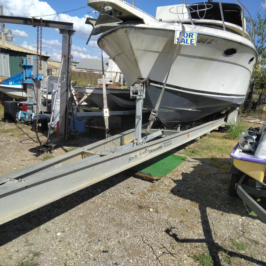 28-32ft aluminum triple axle boat trailer. Must take boat with it $5000