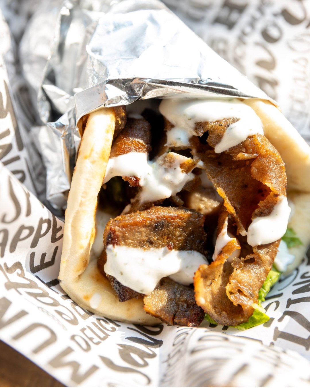 When the gyro craving hits, Mazzah delivers. Your choice of meat, wrapped in a warm pita with your pick of sauce, these handhelds are stacked with flavor and made fresh to order. Want more? Make it a combo or platter to turn it into a full-on meal.
It’s fast, filling, and seriously satisfying. You’ll find them inside The Warehouse Food Hall, serving it up with a smile.