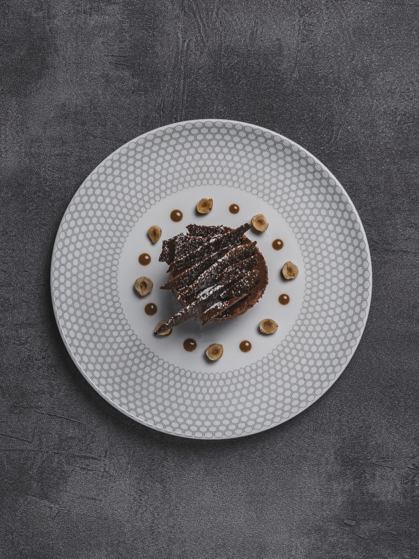 An exquisite dessert that beckons with indulgent chocolate flavours and intricate design.
Savour the rich chocolate, crunchy hazelnuts, and velvety chocolate sauce, all centered around a majestic, layered chocolate masterpiece made using Itakuja double fermented chocolate from Valrhona.
Book your table now via link in bio.
54 Amoy Street, Singapore 069880
#54steakhouse #amoystreet #chocolatesg #chocolatedessert #54amoystreet #steakhousesg #steakhousedinner #steakhouselunch #foodart #foodart #valrhonachocolate