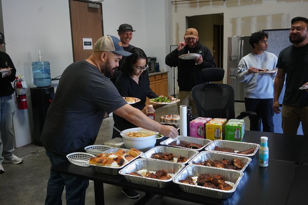 ๐ฅ๐ Last week, our warehouse turned into a BBQ zone, and the C2 Team came together for food, laughs, and a midweek reset.
From Taylor Kelley:
โSometimes the best thing you can do for a team isnโt another meeting or email, itโs firing up the grill. Workdays can get packed with projects and deadlines, so we set aside time to slow down and connect before the weekend. Alan and I rolled the grills into the warehouse and invited everyone across engineering, consulting, data, and field services. The goal was simple: good food and conversation.โ
From Alan Wu:
โBBQ is about transformation, which takes time and effort. With a tight weekday window, I optimized the cook so lunch stayed on schedule:
โข Menu, whole chickens broken down into breasts, thighs, wings, and drumsticks. Christopher Friesen mixed a custom blackened seasoning. Ribs, St. Louis cut, with custom rib rubs.
โข Airflow, halved the racks and stood them vertically to keep air moving and speed up cooking.
โข Orchestration, two grills, three temperature probes, and an AI-optimized schedule to sequence cook times by cut so everything finished together.โ
Taylor Kelley added, โI didnโt think it was possible to โproject manageโ ribs, but somehow he pulled it off, and the food came out perfect. We plated at 12:25 pm, five minutes ahead of schedule, and the best part was hearing teams who rarely cross paths trade stories over lunch. Big thanks to Alan, Christopher, and everyone who helped make it happen!โ
#C2Group #LifeAtC2 #TeamCulture #PeopleFirst #Engineering #Utilities #Infrastructure #OfficeLife