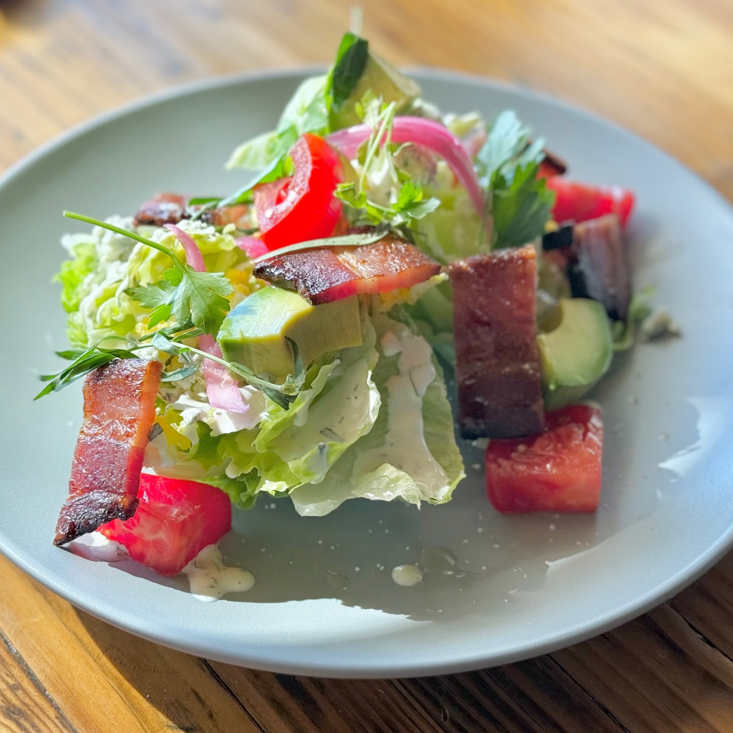 Hey Brentwood - meet the BLTA WEDGE w/bacon, cherry tomatoes, avocado, iceberg lettuce, hard-boiled egg, pickled red onion, blue cheese crumbles, and herb ranch dressing. Feel free to add chicken or salmon if you're feeling extra zesty! 🥗🔥
.
.
.
#WineCountryComfort
#RootedInBrentwood
#HonestFoodGrownHere
#FarmToForkCalifornia
#RusticElegance
#ScratchKitchenStyle
#BoldSeasonalFlavors
#CultivatedComfort
#BrentwoodFarmToTable
#EightAcresExperience