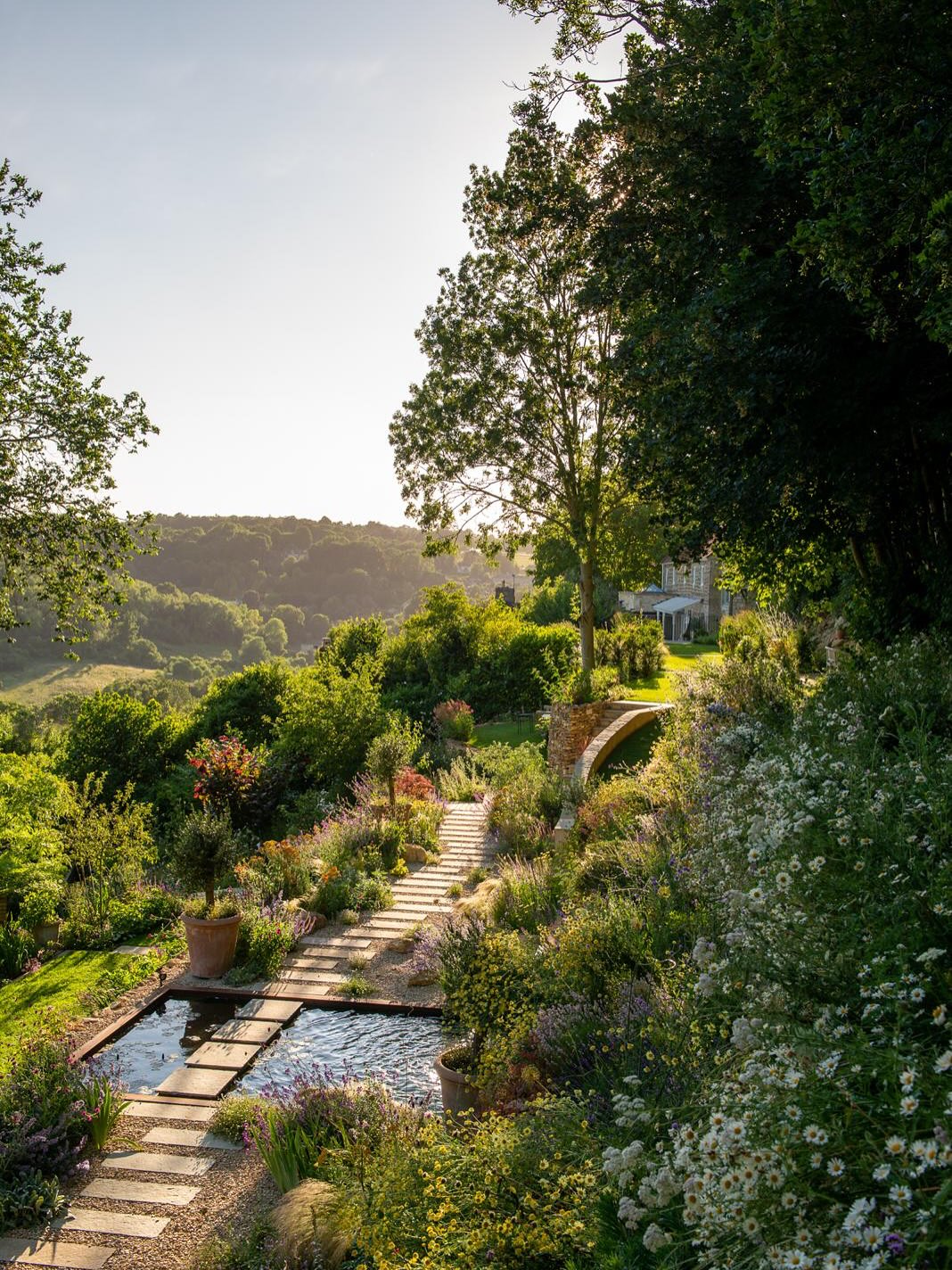 We are excited to share that our Old Quarry Garden has been shortlisted for the Society of Garden + Landscape Designer Awards 2026. We are absolutely thrilled to be included amongst such esteemed talent.
The design of this garden has completely transformed a steep, virtually unusable site into a series of terraces each with their own individual character. Succession planting throughout ensures that there is something to enjoy all year round no matter how you navigate the garden. Biodiversity and sustainability were key components of the brief. A variety of habitats were created including water that cascades between the terraces.
This garden can also be voted for in the People’s Choice category. We’d be thrilled if you would like to vote for us, as every vote counts! Link below and in bio
Voting closes 31st October 2025 https://sgld.org.uk/events/awards/peoples-choice/2026/vote
Photograph @heatheredwardsgardens Construction @tristan_sutton_landscapes Plants Chichester Trees & Shrubs. Trees Griffin Nurseries & Kingstown Nurseries. #sgldawards2026 #terracedesign #mediterraneanplanting #gardendesign #bathgardens