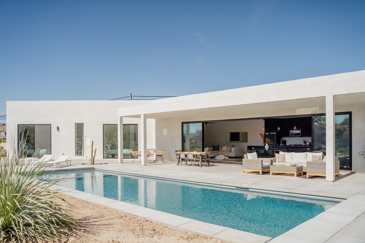 Perfect for the sunrise dip types and the chill-all-day-until-sunset crew. With seamless indoor-outdoor flow, Mars Landing extends day into evening effortlessly.
The only thing left to think about? Catching the sun anytime you please.
A pool for living in. This one’s perfect for when it’s time to find some sun.
#yuccavalley #desertvacation #joshuatreenationalpark #falltravel #vacation #getaway #getawayweekend #outdoorliving #desertescape #familytravelling #saturdayinspiration #joshuatreeretreat #holidayretreat