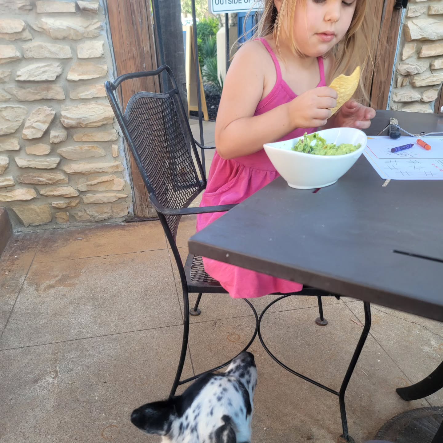 Eating dinner on a patio with my two young ladies!