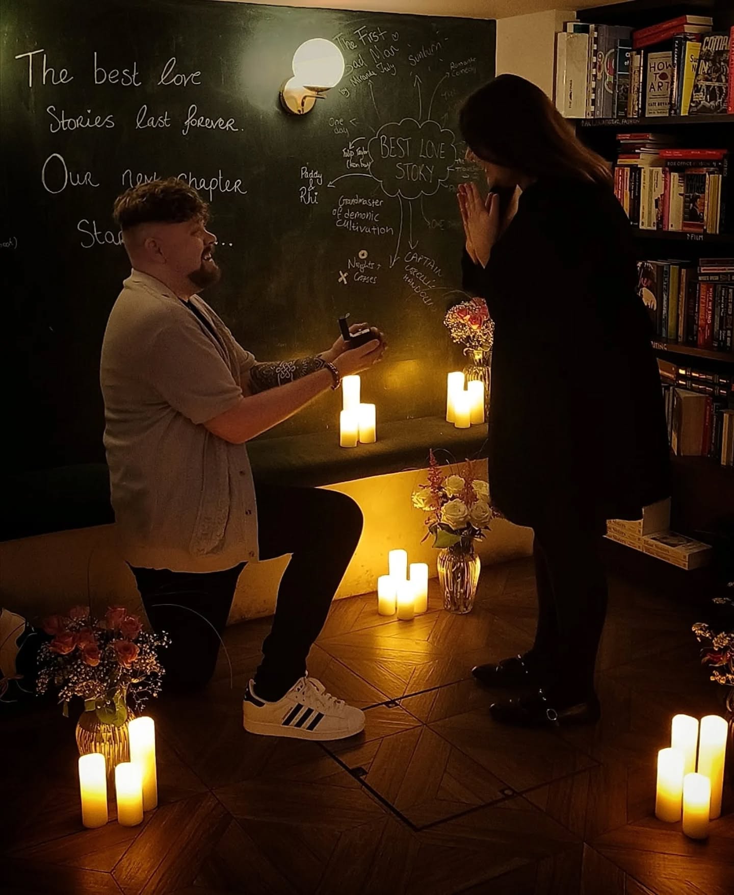 We love love ♥️
The biggest congratulations to Paddy and Rhiannon who were engaged at our Highbury shop a week past Saturday.
It was a truly magical proposal which involved a book of their love story hidden on our shelves, a photographer posing as BookBar's new marketing assistant, some very devious booksellers, and candles (not real, because, books), flowers and our Rec This Wall put to good use in our downstairs Book Cellar. If you have written your favourite love story on the wall over the last few weeks you too were complicit in helping Paddy and the BookBar team pull off the proposal of the year (move over TS and TK)!
Utterly romantic! We wish you both the happiest ever after ✨♥️