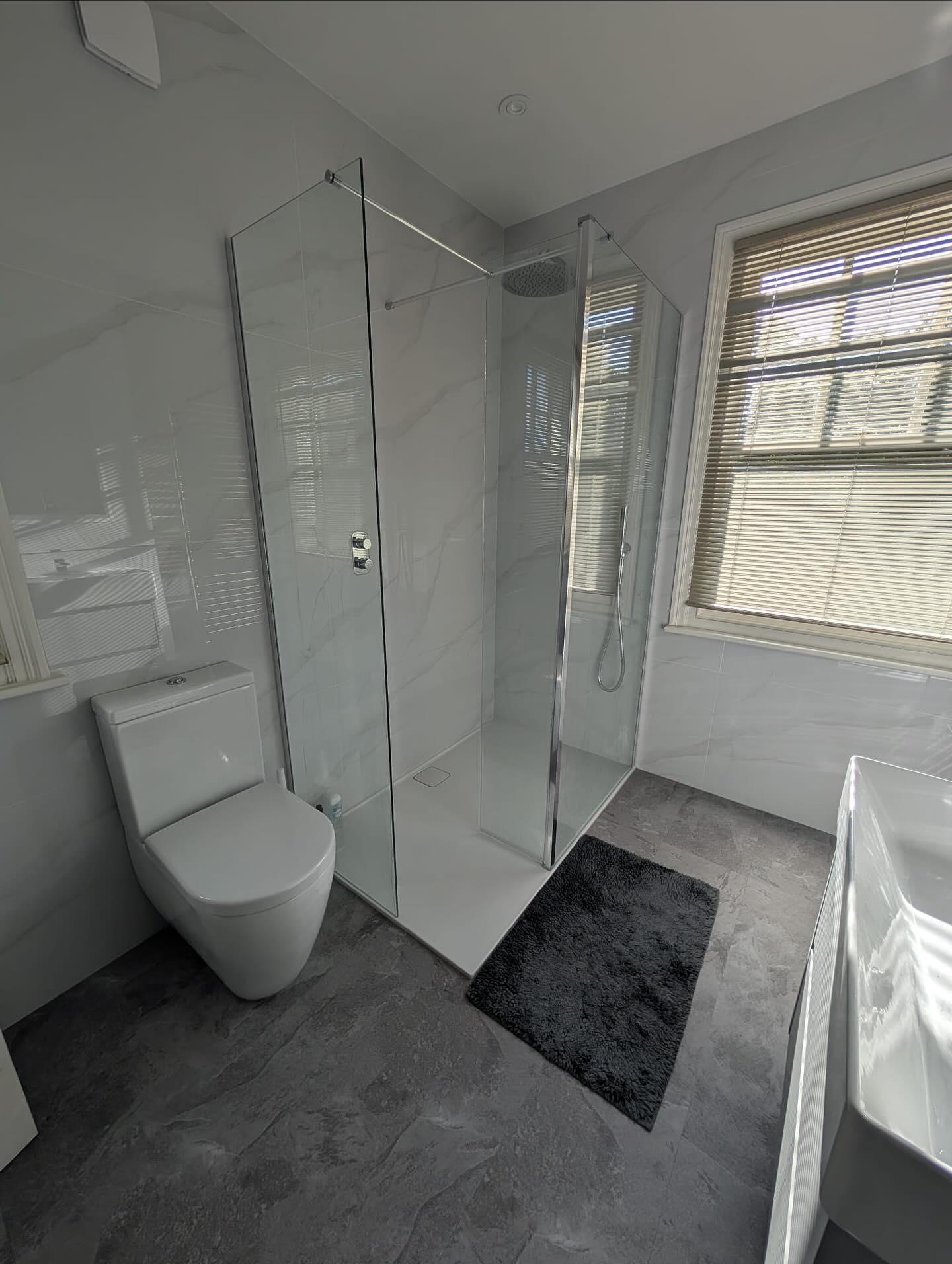 Loving how this sleek bathroom turned out thanks to James at @aquipped 💫
This bathroom completed in Guildford features our Endless Carrara tiles, complemented by the darkness of the Endless Slate Veil. Look how every tile perfectly wraps into the next! 🤩
The contrast of light and dark marbles with frameless glass and shiny chrome brassware create the perfect modern and clean style the customer was after ⭐️✅
Swipe to see the CAD plans before they turned into reality! ➡️
This bathroom features:
Merlyn’s super slimline Level25 shower tray and Wetroom Collection glass panels for the perfect easy-clean minimalistic style 🧽
Stunning yet durable brassware from Vado’s Tablet Altitude and Aquablade ranges ✨
GSI’s Kube wall hung basin and tall unit in matt mid grey paired with the Pura close coupled pan with the brilliant Swirlflush feature 🌀💧
The amazing Vanquish recessed mirror cabinet from HiB with adjustable LEDs and demister pad, perfect for hidden storage and that daily face care routine ♨️ 🧖♀️
JIS Europes Beacon stainless steel towel warmers symmetrically placed either side of the chimney breast keeps the room super warm and stylish 🔥
@vado_uk @jiseuropeltd @merlynshowering @gsiceramica @farmiloe_gsiceramica @hib_bathrooms
#bathroominspiration #bathroomdesign #bathroominspo #interiordesign #bathroomrenovation #bathroomdecor #bathroomvanity #bathroomtiles #bathrooms #bathroomsofinstagram #bathroomsofinsta #bathroomstyle #luxury #luxurybathrooms