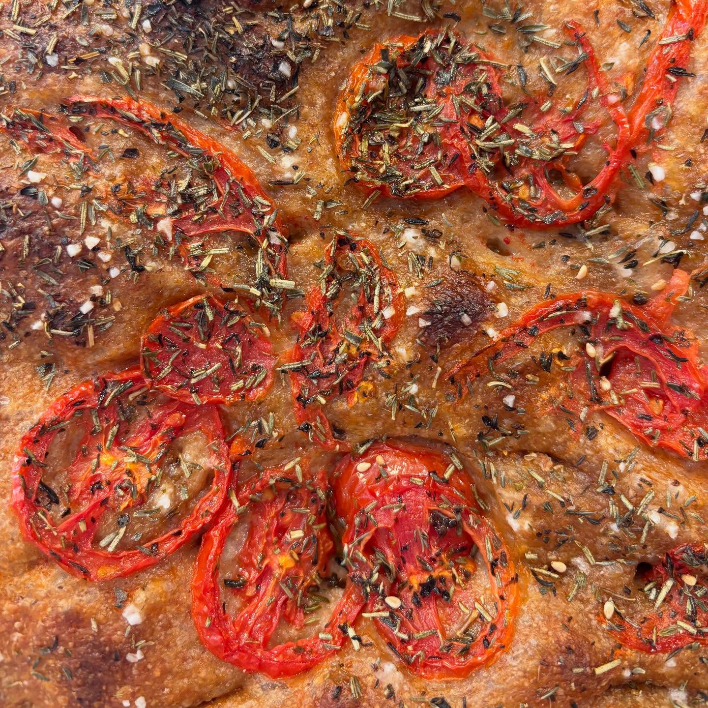 The last of this season's tomatoes are a focaccia special this week! Topped with @burlapandbarrel herbes de provence. Get it while you can!
