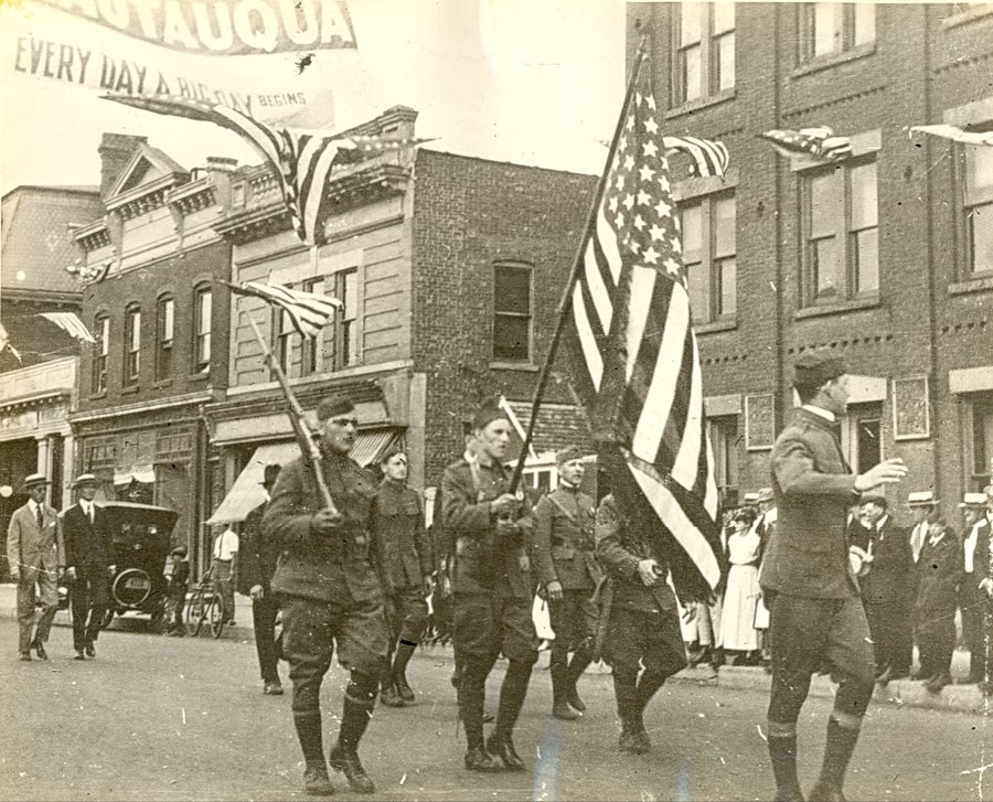 In honor of Veterans Day, we’ll go back to October 13, 1919, when American flags and patriotic buntings adorned the homes and businesses throughout Rockville Centre. A full day of festivities had been organized by the Rockville Centre Business Men’s Association to mark the end of the Great War (WW1) and to honor the returning servicemen from Rockville Centre and Oceanside.
The celebration featured a grand parade, lively street dancing, and a clambake dinner with cabaret-style entertainment at the Rockville Centre Club’s clubhouse—today known as the Masonic Hall at 28 Lincoln Avenue. During the dinner, Village President Russ solemnly read aloud the names of the eleven local residents who had given their lives in service to their country.
Each of the more than 250 returning veterans received a special welcome-home gift. The young men were presented with gold signet rings bearing an eagle emblem, while the five women who had served as nurses and yeomen received gold pins adorned with laurel leaves. Both keepsakes were engraved with “Rockville Centre, Oct. 13, 1919” on a red, white, and blue background. The funds for these tokens of gratitude were raised by the residents of Rockville Centre and Oceanside themselves.
To further honor those who did not return, their names were later inscribed on a memorial plaque now located on College Place near Village Hall, as well as on the front of the new high school built in 1924—today’s South Side Middle School. Thank you to all our Veterans who served our country. #rvc #rvchistoricalsociety