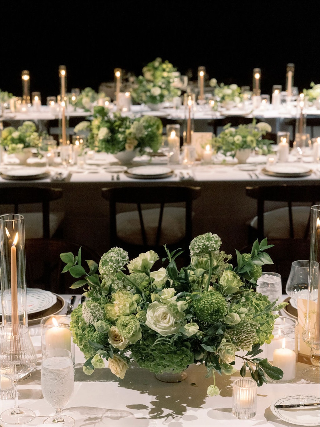 Green is the new glam. 🌿✨
Rows of overgrown greenery centerpieces, moody candlelight, and warm earthy accents set the tone for an effortlessly elevated tablescape. Earthy, modern, and undeniably chic — proof that nature never goes out of style. Would you try this color palette?
@matthewhanlon
@michelbevents