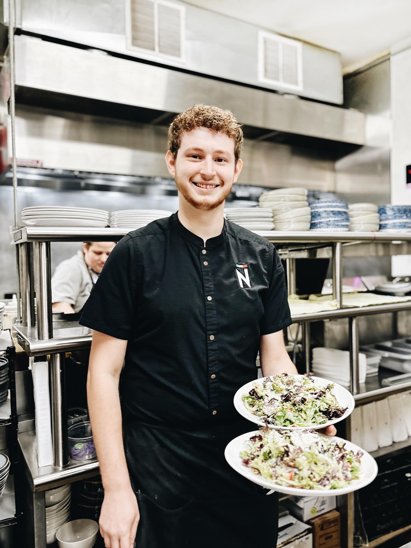 Meet Jacob, one of our lead servers and, quite honestly, a true staple at Noto.
Being a server is about so much more than taking orders and delivering food. There is a real craft to providing excellent service, and Jacob embodies it completely. He’s here to share his knowledge, guide you through your meal, anticipate your needs, and leave you with a warm smile and an experience that goes above and beyond expectations.
It takes a team of passionate individuals to run a restaurant, and Jacob is a true leader among our front-of-house team. He trains new hires, teaching them Noto’s core standards and how to deliver exceptional service to every guest. He’s also the type of person who steps in wherever he’s needed, whether that’s washing dishes, bartending, or helping out on the pizza station. No task is too small or beneath him, and no challenge too big or intimidating.
That’s just the kind of person Jacob is, someone we’re incredibly fortunate to have on our team.
Jacob embodies everything Noto stands for: curiosity to try new dishes, a passion for learning and sharing knowledge, a dedication to creating the perfect night out for our guests, and a deep sense of camaraderie with his team.
Thank you, Jacob, for your many years of service and for being a true star ⭐️ in our Noto family.
