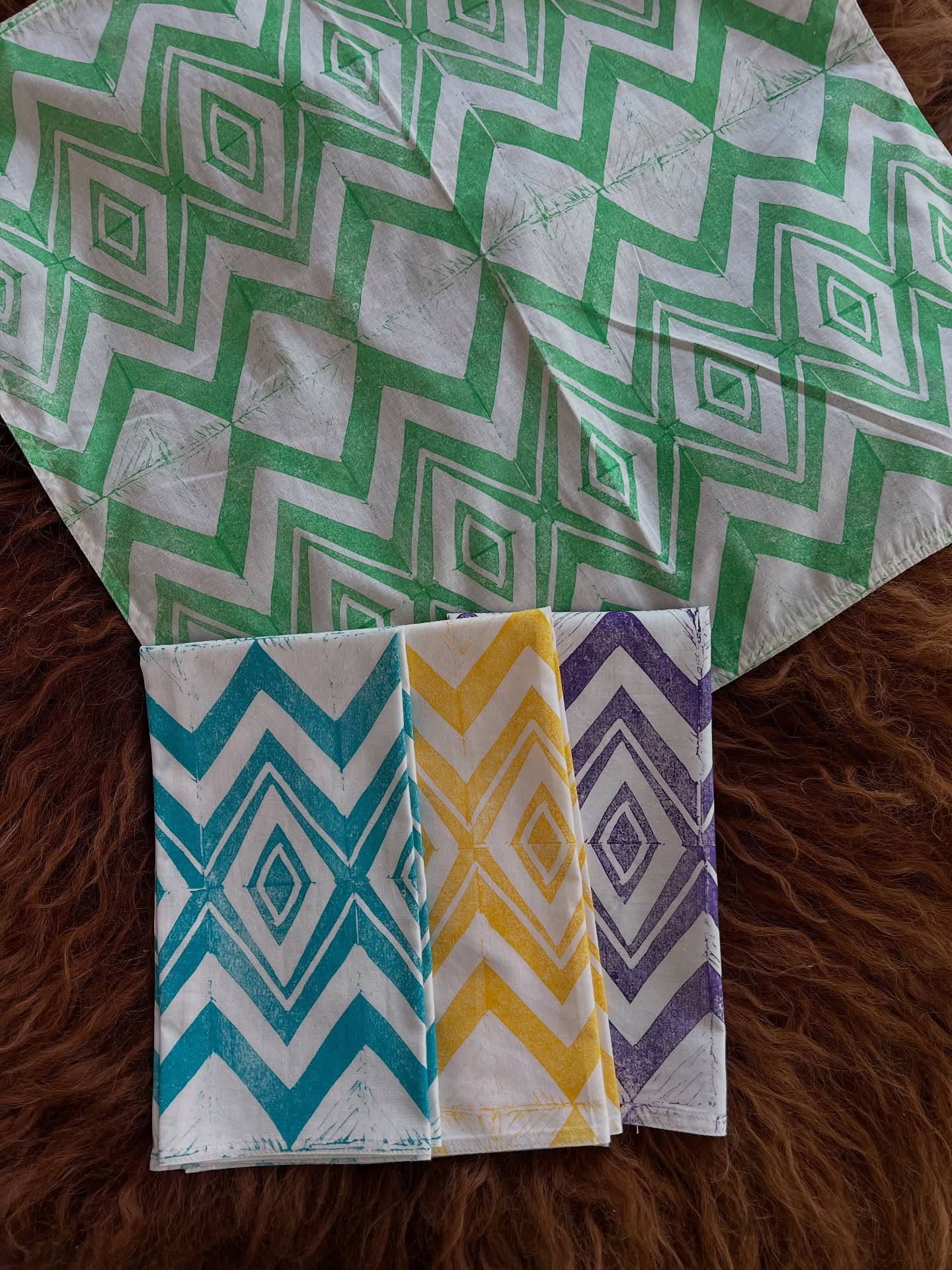 Another day, and more beautiful artisan textiles across your feed! Today I’m sharing napkin sets. Made from organic cotton these are soft-to-the-touch, and with each wash the texture becomes more buttery.
Scroll through to see 17 different patterns! Recently, Ive been experimenting with multicolor sets (peep the chevron pattern) and am loving the bright colors all together.
Some of these are available in sets of 2, some in sets of 4, and others 6. It’s a little tricky on insta to comment on photos, so check my stories to see which come in what size set. I’ll post the stories to my highlight reel.
$30/2 $50/4 $70/6
All are block printed using hand carved wooden and lino blocks. This current inventory is about half my own carvings, and half I’ve sourced from India. Did you know that at one point England tried to outlaw Indian blockprinted textiles? The colors and patterns were so vibrant the government worried that their own textile manufacturing would be outshined. (And it was!) Despite laws passing, the fabrics remained very popular and the attempt to ban them was unsuccessful.
The histories of fabrics and colonialism are deeply entwined, which is part of why craft is always political! We are not separate from our supply chains. Shopping at local small businesses offers the opportunity for transparency, and empowers you in making decisions about what systems you are supporting.