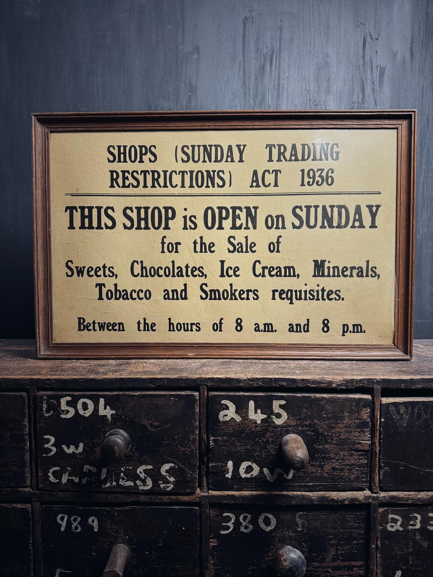 SOLD-Keeper for a while. An early 20th century oak framed shop card counter, window sign instruction the Shops Act of 1936 relating to Sunday Opening Hours. The sign permits the premises to be open for 12 hours on Sunday to sell tobacco etc. Printed in classic letterpress with bold slab-serif headings. A wonderful piece of British retail history. Circa 1936. Size: 55cm x 35cm #britishretail #oldshopsign #shophistory #retailhistory #britishshops #britishantiques #shopantiques #vintageshop #antiquesigns #interiordecor