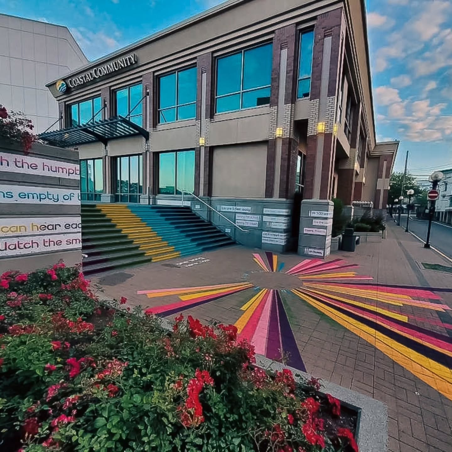 This installation is from 2020. In late 2019 we were commissioned by the City of Nanaimo for a different project. It was intended to be small street art interventions that would pop up around the city and we had created an entire marketing plan and social media campaign around this. Fast forward to staffing changes and a pandemic, we were asked to instead pivot and create an artwork that was appropriate for the covid-19 restrictions.
We identified a place in Nanaimo that we believed was under utilized and we wanted to give folks a reason to take a new route and go "what's that?".
So, One Song stairs case was born. It was intended to be a temporary art piece, however, its currently still in existence. We collaborated with the past Poet Laureate of Nanaimo Tina Biello and asked if she could create a poem about social distancing and she created 'One Song'.
We then took that poem and transformed the square with poetry and created a large radial Soundwave (of the poem being read) across then ground. The intention was to create space and build connection through the same artwork.
Its been very cool to observe how people use the space. Actually, thats the best part of being a public artist.. visiting the artwork once its completed and observing how the public choses to interact with it.
(Art work created under the alias Humanity In Art - the artistic partnership between Lys Glassford and Lauren Semple)
#wallmural #customart #publicart #commercialart #nanaimosmallbusiness
