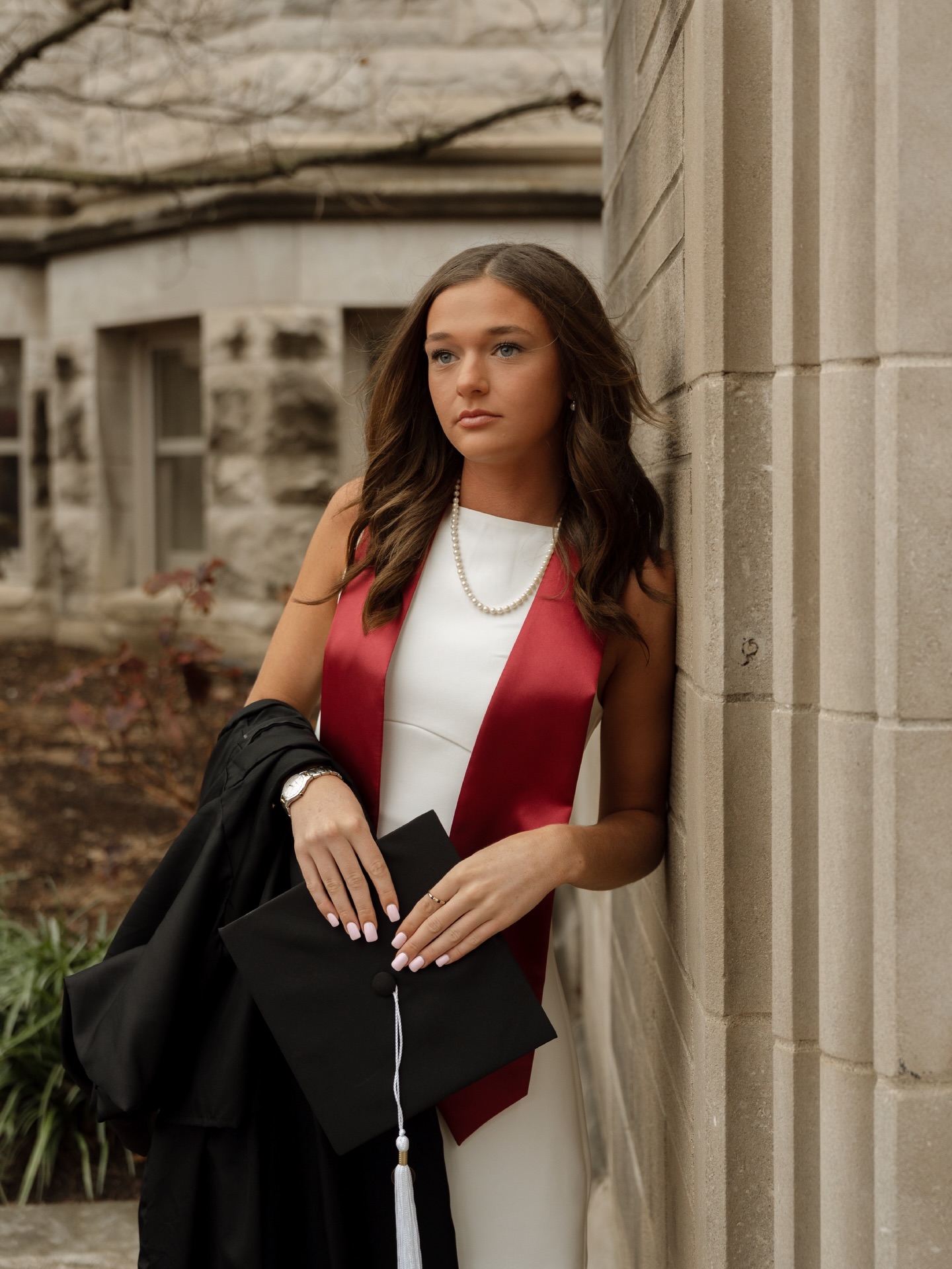 What’s so wild is I used to baby sit Sarah and her 2 older siblings… and now here she is, graduating from college 🥹 so proud of your girlfriend, and can’t wait to hear about how much you’re going to love Texas!
I have 2 bits of news with this sessions - one bad and one good. Since this session was obviously in Indiana, I don’t have a ton of flexibility for session dates. Bloomington was super gloomy this day. Sarah’s hair didn’t handle the periods of rain very well (bad news).
But luckily, I have a secret little talent of styling hair. So, we just went back to her apartment for a few minutes so I could throw her hair up in a cute little pinned up bun (good news)!
There’s been a handful of times that I’ve helped with bridesmaids’ hair on a few wedding days. Just know that if you need help with hair adjustments, I always got you 😉